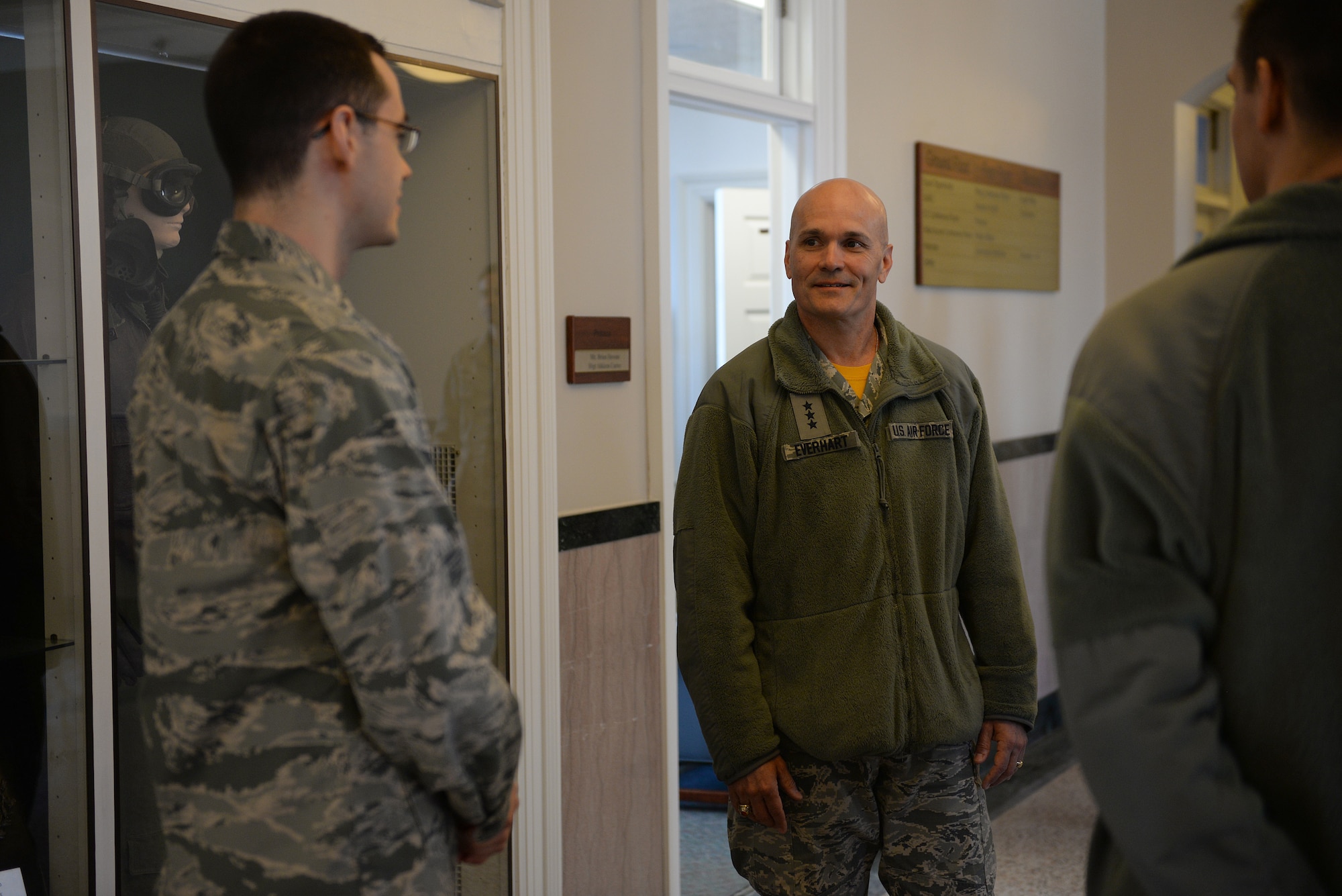 Lt. Gen. Carlton D. Everhart II, 18th Air Force commander, talks to 2nd Lt. Cody Anderson at Scott Air Force Base, Illinois, March 6, 2015. Everhart received a wing briefing at the 375th Air Mobility Wing Headquarters building for an overview of each component of Team Scott. (U.S. Air Force photo by Airman 1st Class Erica Crossen)