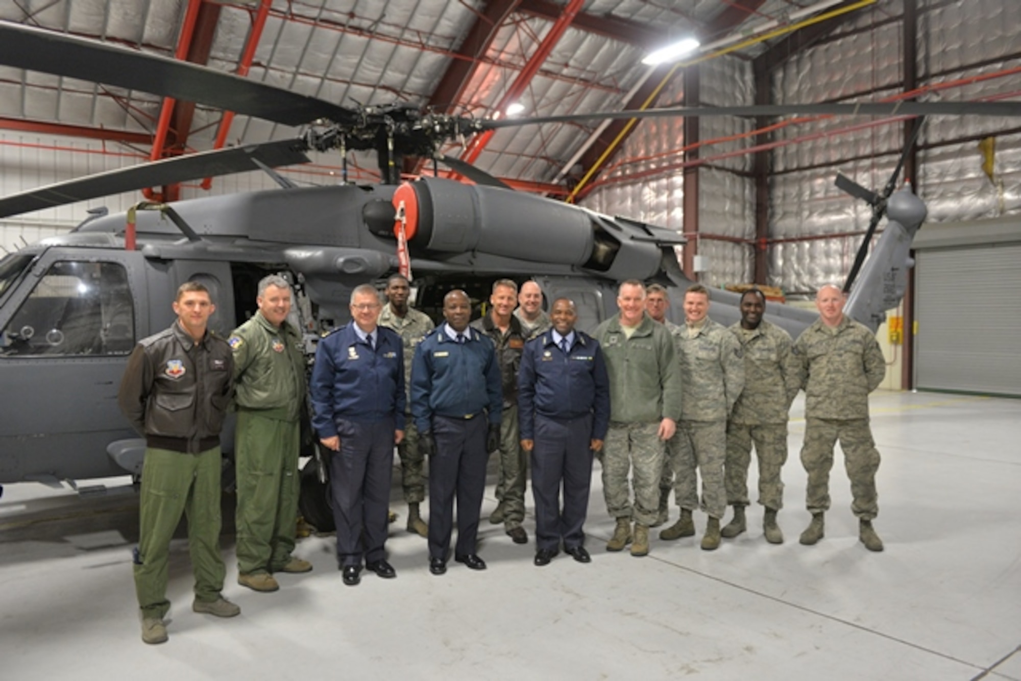 WESTHAMPTON BEACH, NY- Members of the South African National Defence Forces, 106th Rescue Wing commader and members pose with the 106th Rescue Wing's HH-60 Pavehawk helicopter.

Maj. Gen. Mbambo and Brig. Gen. Mashoro Phala visited the 106th Rescue Wing in Westhampton Beach, New York, as part of the South African Natioanl Defence Force's State Partnership Program relationship with the New York Natioanal Guard.

(New York Air National Guard/ Airman 1st Class Mark Weiss/ released)
