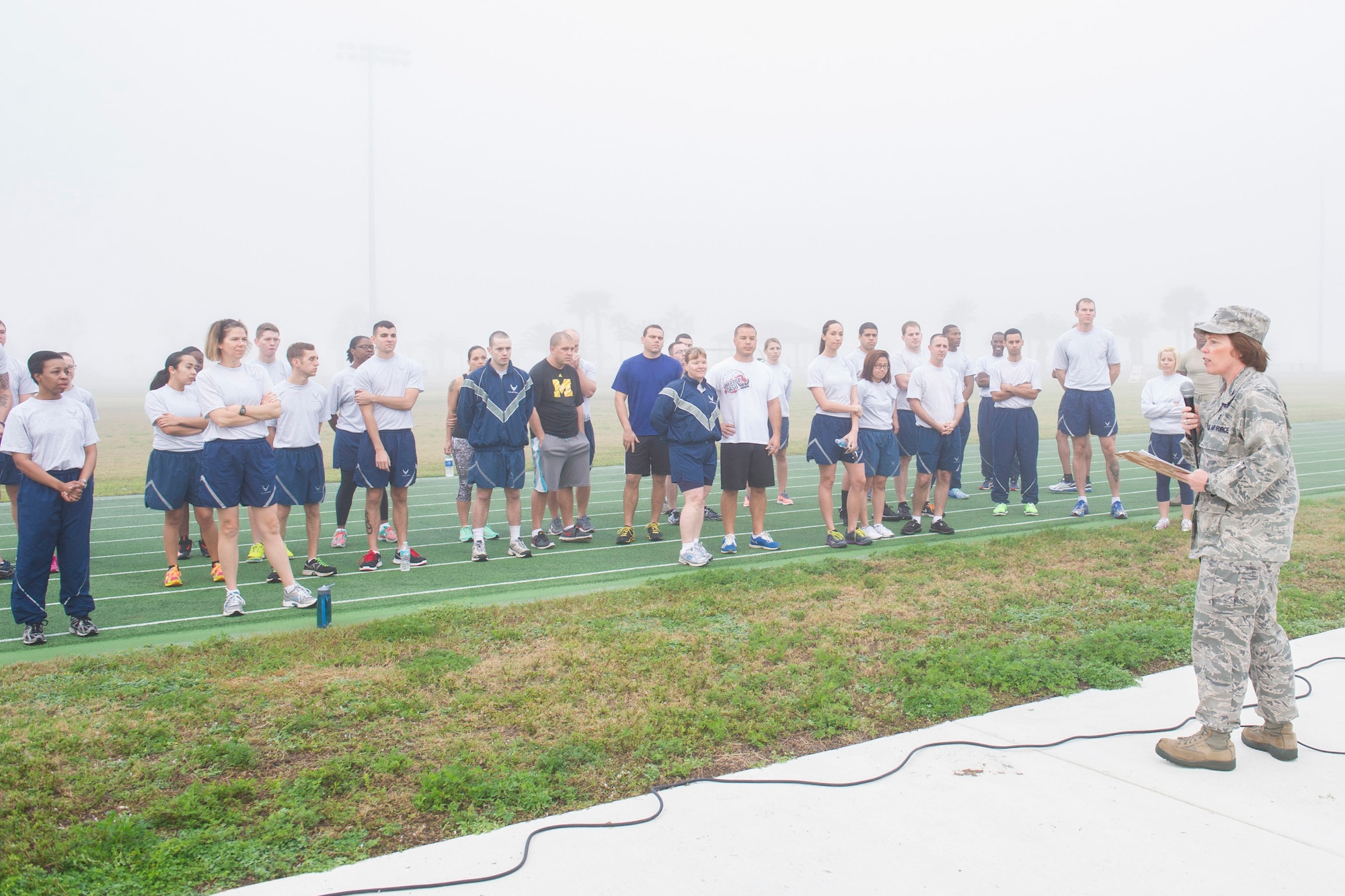 Col. Julie Stola, 45th Medical Group commander, provides opening remarks for the Women’s History Kick-off Obstacle Course event March 2, 2015 at Warfit Field, Patrick Air Force Base, Fla. (U.S. Air Force photo/Matthew Jurgens)