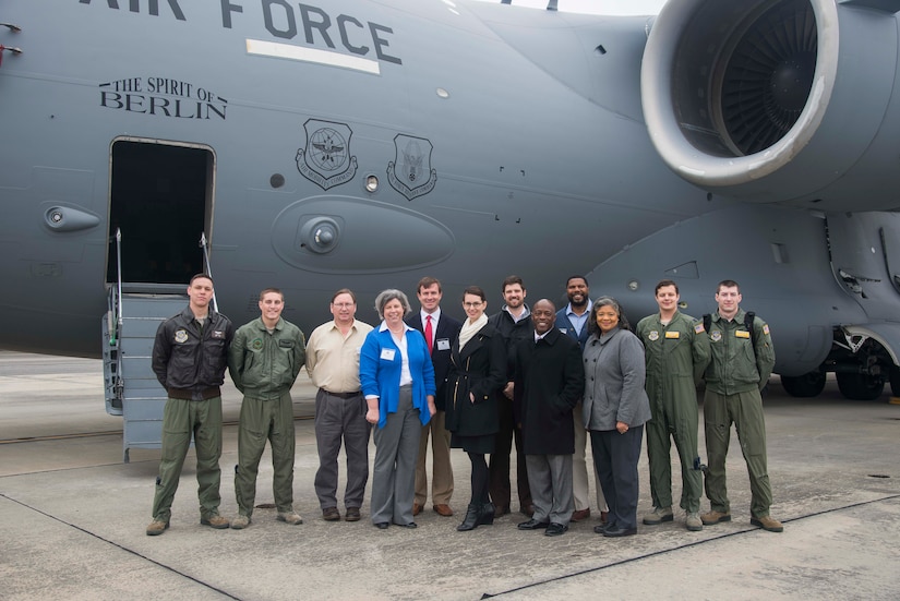 The newest members of the Joint Base Charleston Honorary Commanders program pose for a group photo during their orientation tour, March 6, 2015, at JB Charleston, S.C. The JB Charleston Honorary Commanders Program encourages an exchange of ideas, experiences, and friendship between key members of the local civilian community and the Charleston military community. The program provides a unique opportunity for the members of the Charleston area to shadow commanders of the Air Force wings and groups, as well as Navy and tenant units at JB Charleston. (U.S. Air Force photo/Senior Airman George Goslin)