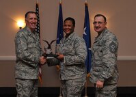 The 2014 Eighth Air Force Senior Noncommissioned Officer of the Year ? Senior Master Sgt. Jessica Ruiz, 608th Air Communications Squadron. Accepting on her behalf, Lt. Col. Patrice Holmes, 608th ACOMS commander. (U.S. Air Force photo/Senior Airman Joseph Raatz)