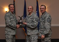 The 2014 Eighth Air Force Noncommissioned Officer of the Year - Tech. Sgt. Nathan Parker, 608th Air Operations Center. Accepting on his behalf, Master Sgt. Wally Lozano. (U.S. Air Force photo/Senior Airman Joseph Raatz)