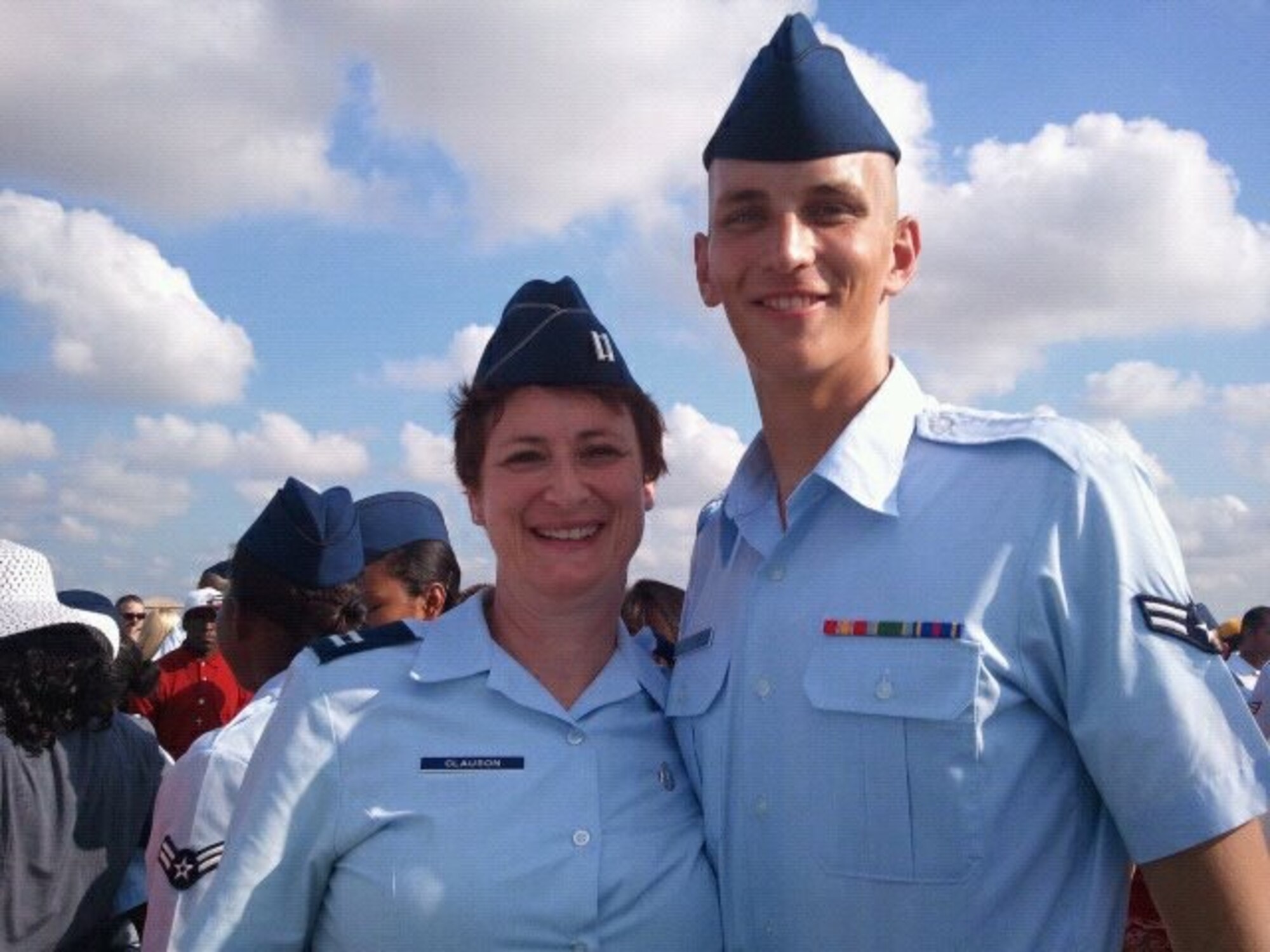 Capt. Dawn Clauson, 99th Medical Operations Squadron pediatric clinic nurse manager, poses with her son, Airman 1st Class David Clauson, 22nd Aerospace Medical Squadron medical technician, during his Basic Military Training graduation in 2011, at Joint Base San Antonio, Texas. Dawn commissioned in 2006, and four of her six children have also joined Air Force. (Courtesy photo)
