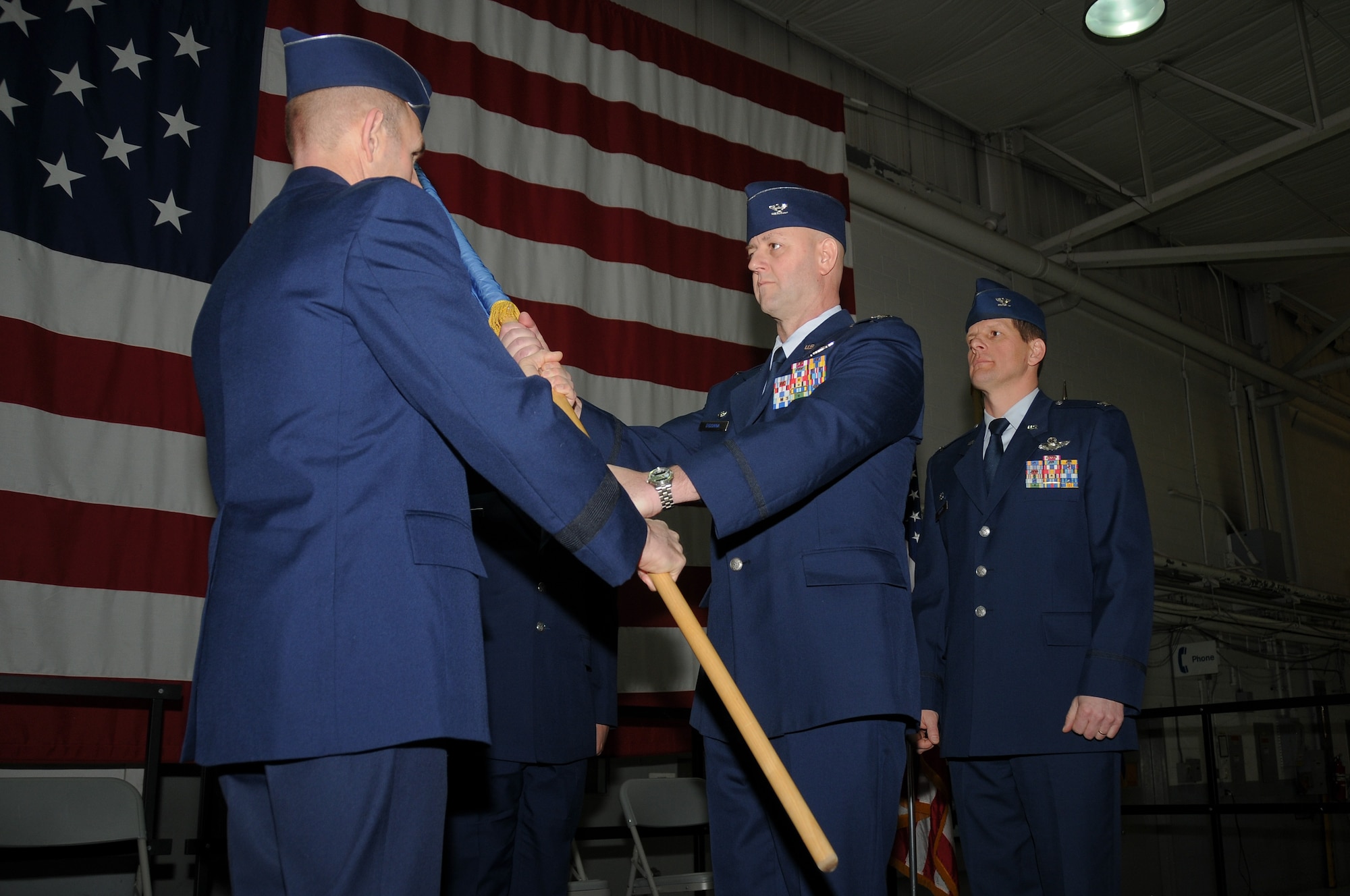 A picture of Col. John R. DiDonna, Jr. accepting command of the 177th Fighter Wing.