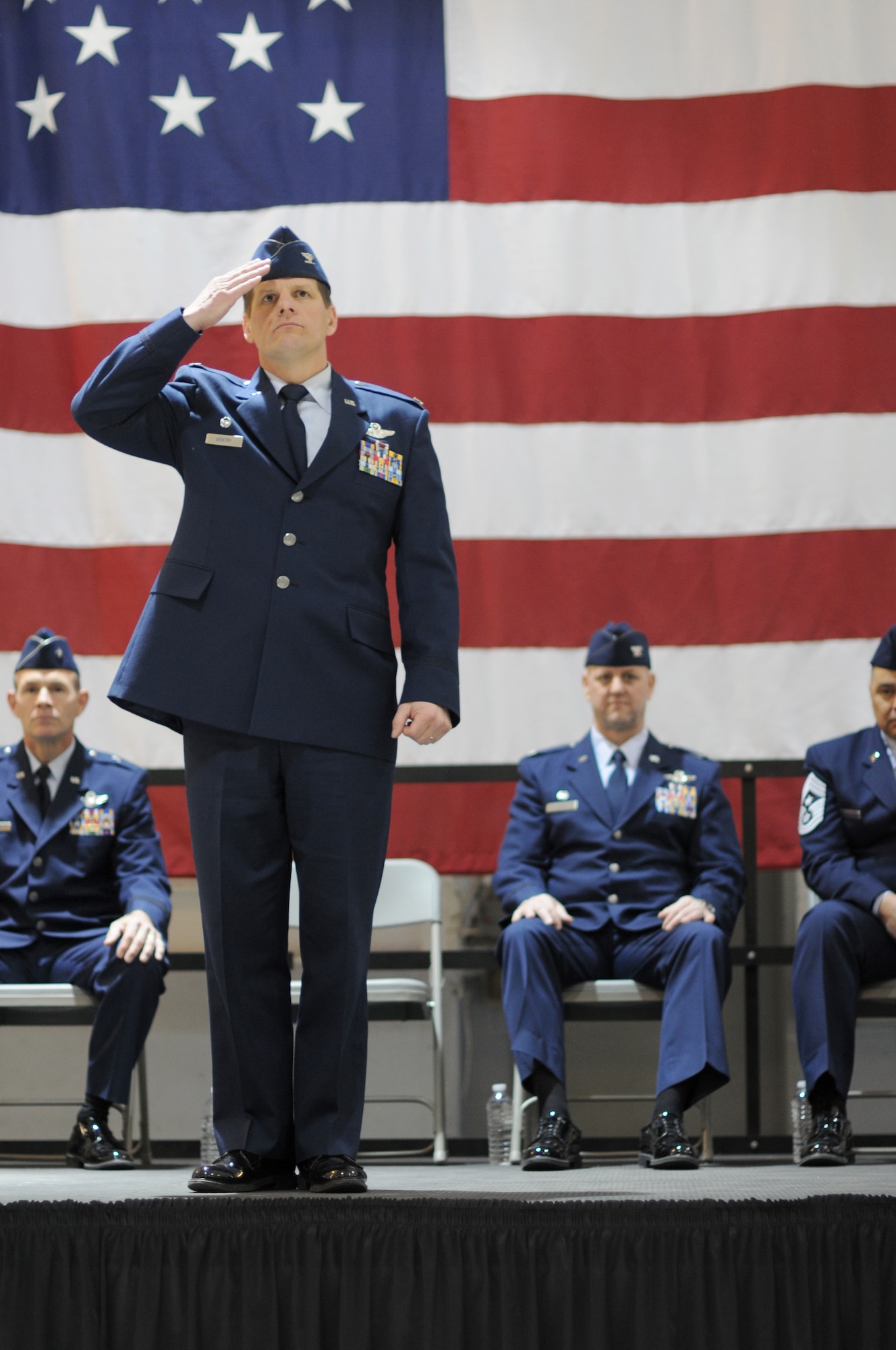 A picture of Col. Kerry M. Gentry, former 177th Fighter Wing commander, saluting.