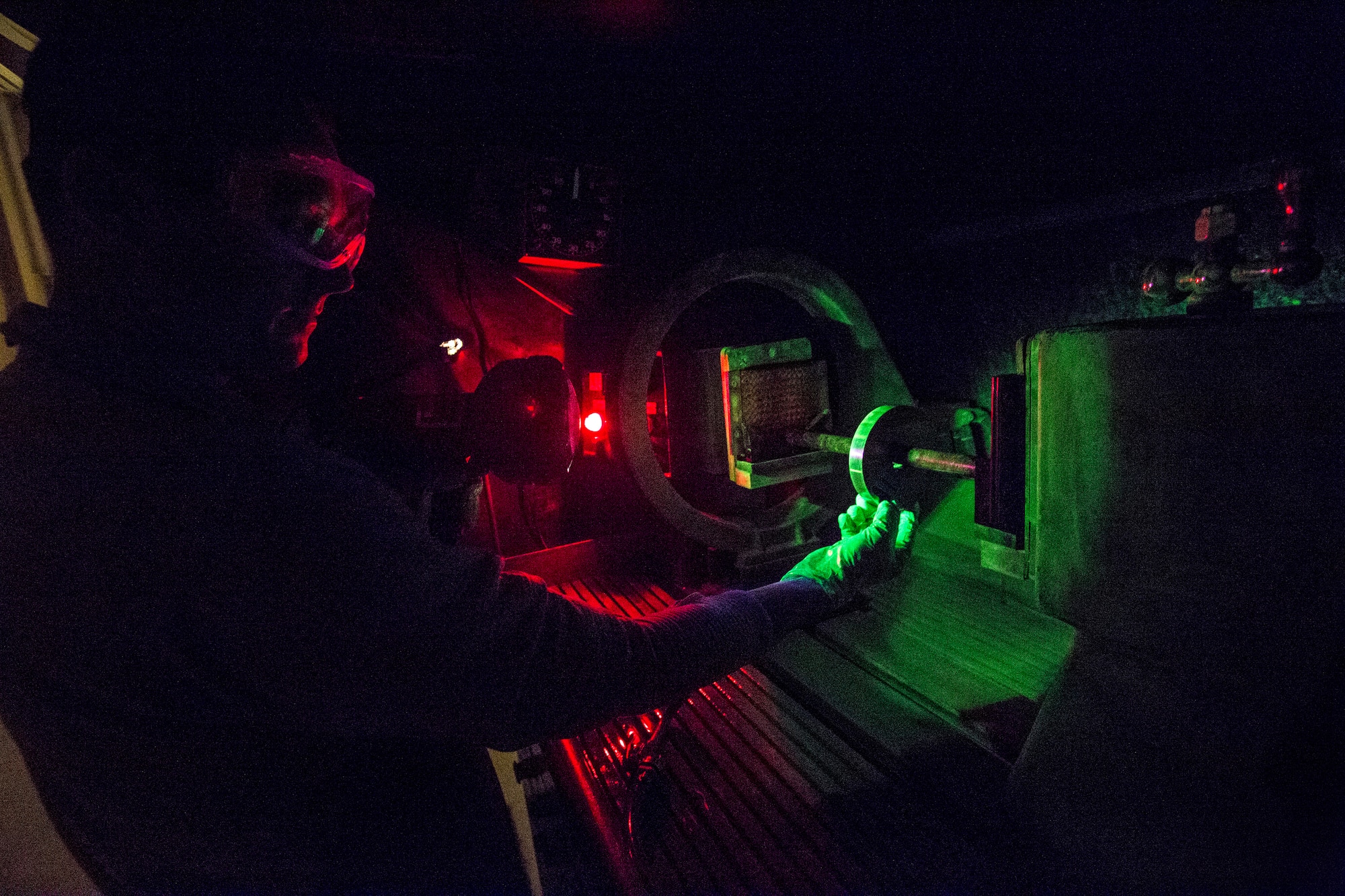 Senior Airman Lucas Derflinger, non-destructive inspection journeyman, 108th Wing, performs a process control using a ketos ring and a central bar conductor on the magnetic particle inspection unit prior to inspecting aircraft parts at Joint Base McGuire-Dix-Lakehurst, N.J., March 7, 2015. The process control involves magnetizing the part, which is then bathed in a suspended particle bath. The bath seeps into the defects and when it is exposed to ultraviolet light – black light, causes the defects to become florescent and visible. The New Jersey Air National Guard NDI Airmen provide support to the structural maintenance program, which ensures that the KC-135R Stratotankers are mission-ready. (U.S. Air National Guard photo by Master Sgt. Mark C. Olsen/Released)