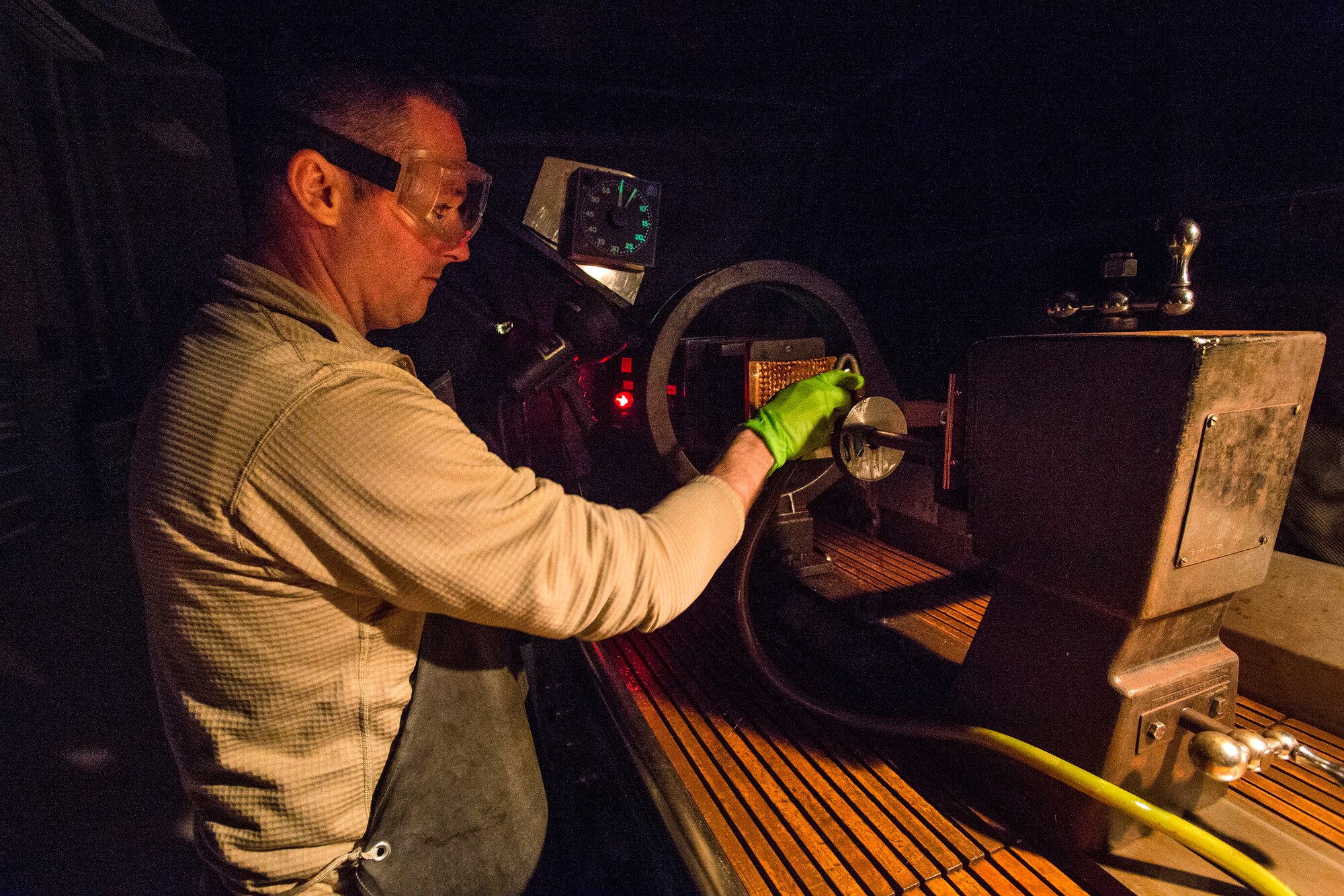 Senior Airman Lucas Derflinger, non-destructive inspection journeyman, 108th Wing, prepares to perform a process control using a ketos ring and a central bar conductor on the magnetic particle inspection unit at Joint Base McGuire-Dix-Lakehurst, N.J., March 7, 2015. The New Jersey Air National Guard NDI Airmen provide support to the structural maintenance program, which ensures that the KC-135R Stratotankers are mission-ready. (U.S. Air National Guard photo by Master Sgt. Mark C. Olsen/Released)