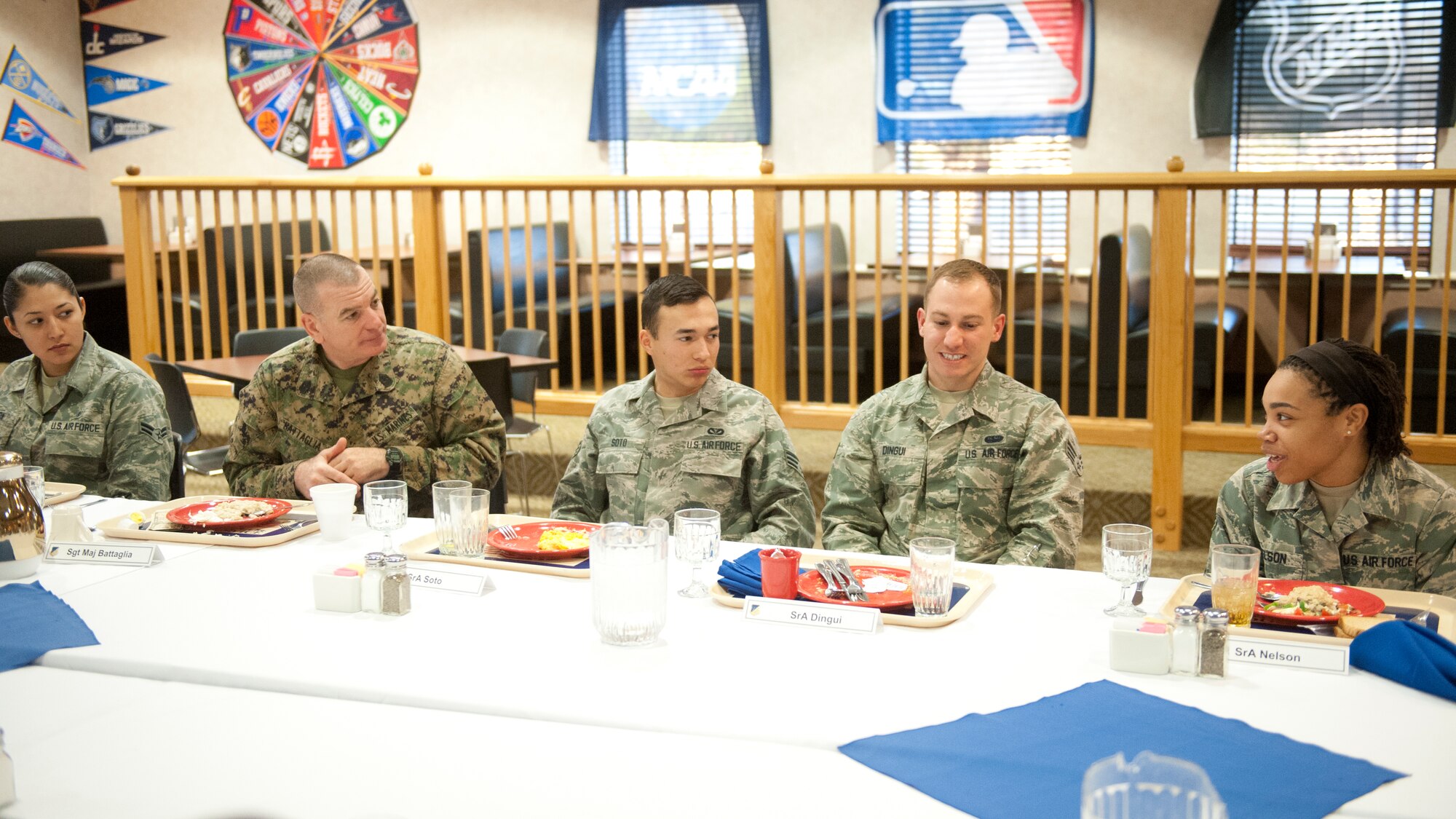 Marine Corps Sgt. Maj. Bryan B. Battaglia, Senior Enlisted Advisor to the Chairman of the Joint Chiefs of Staff, speaks with airmen during breakfast at the Shifting Sands Dining Facility, Holloman Air Force Base, N.M. March 6. During his visit to Holloman, Battaglia toured the various units on base and met with Airmen. Battaglia visited with Airmen and received Holloman mission briefings prior to speaking at the 2015 Chief Master Sgt. Induction ceremony. (U.S. Air Force photo by Airman 1st Class Emily A. Kenney/Released)    