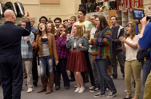 Skyline High School students sing Journey’s, “Don’t Stop Believin’,” with Senior Master Sgt. Ryan Carson, U.S. Air Force Band Max Impact vocalist, during an educational outreach program in Mesa, Ariz., Jan. 30, 2015. Max Impact mentored, advised and educated students during an Advancing Innovation through Music clinic. (U.S. Air Force photo/ Senior Airman Nesha Humes)