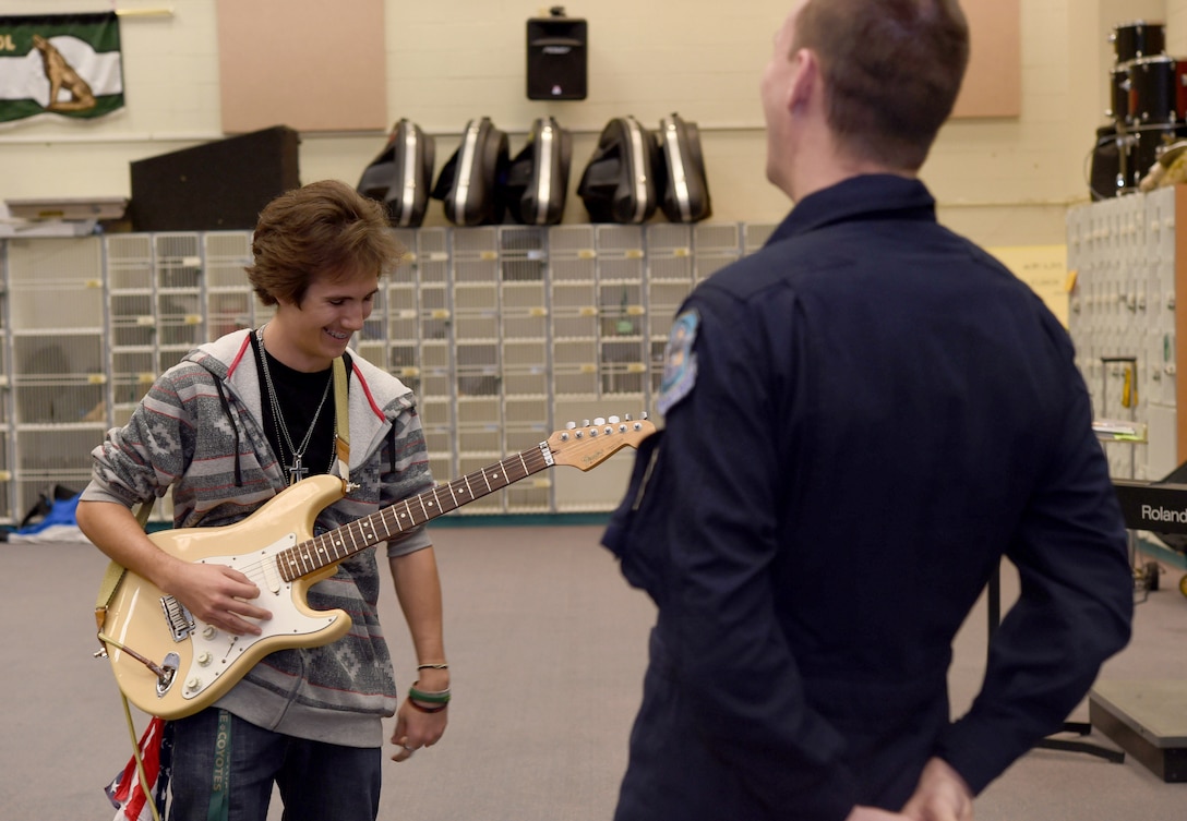 Zach Misino, Skyline High School student, plays for Master Sgt. Matthew Geist, U.S. Air Force Band Max Impact guitarist, during an Advancing Innovation through Music clinic. In 2014, the USAF Band reached over 15,000 students through more than 75 AIM events. 