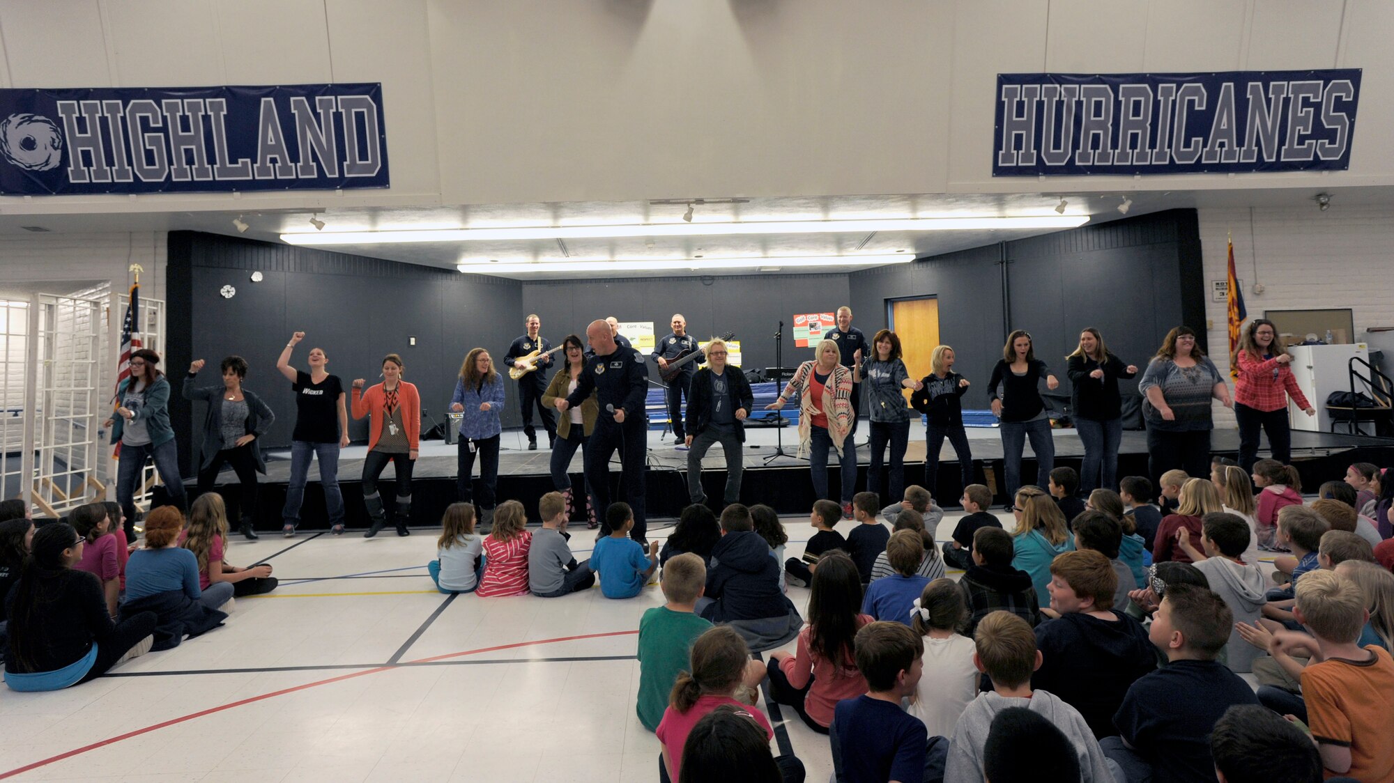 Highland Elementary School teachers dance for their students during a U.S. Air Force Band Max Impact performance in Mesa, Ariz., Jan. 30, 2015. Max Impact taught students about U.S. Air Force values in addition to a performance during an Advancing Innovation through Music clinic. (U.S. Air Force photo/ Senior Airman Nesha Humes)