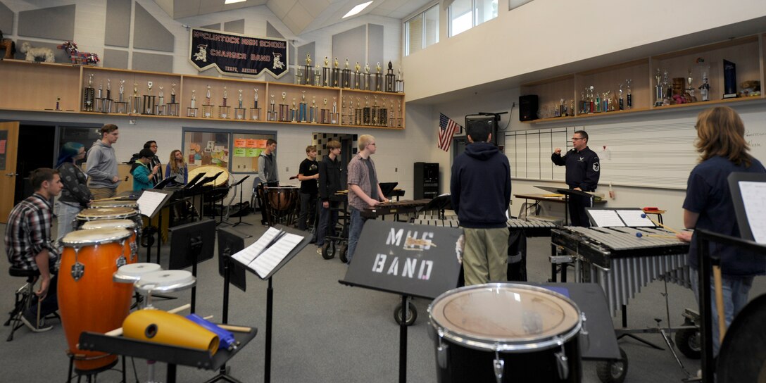 U.S. Air Force Band Ceremonial Brass percussionists, talk to students about instrument techniques at McClintock High School in Tempe, Ariz., Jan. 27, 2015. In between country-wide performances, Band members hold Advanced Innovation through Music clinics to advise, mentor and educate students on music.  (U.S. Air Force photo/ Senior Airman Nesha Humes)