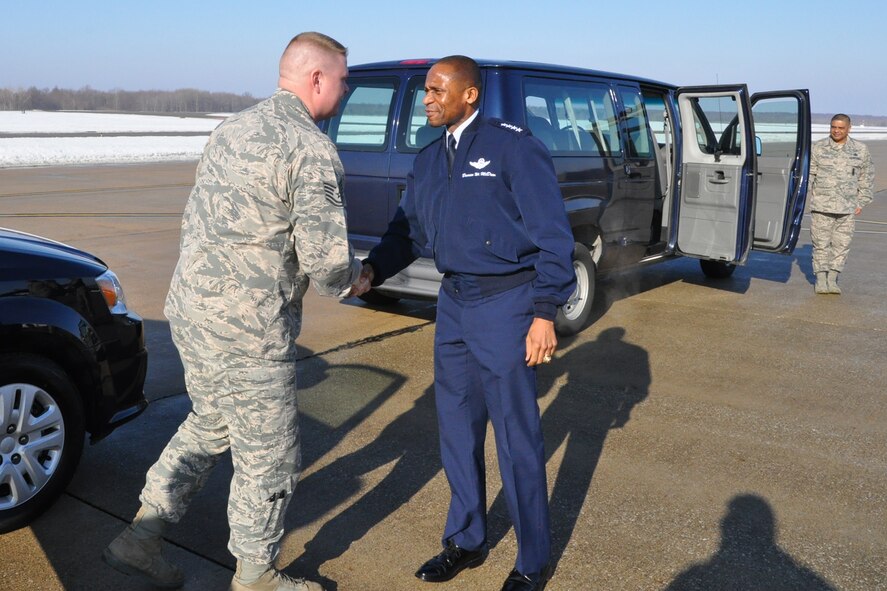 YOUNGSTOWN AIR RESERVE STATION, Ohio – Air Force Reserve Tech. Sgt. Chad Schlimm, 910th Security Forces fire team leader, shakes hands with Air Mobility Command Commander Gen. Darren W. McDew, while Master Sgt. Joey Rivera, 910th Security Forces operations sergeant, watches on the flightline here, March 9, 2015. Schlimm and Rivera were assigned as drivers for McDew, a four star general, and his staff during their visit here to meet with wing leadership, tour the installation and get an up close look at the 910th’s mission and capabilities. U.S. Air Force photo by Master Sgt. Bob Barko Jr.