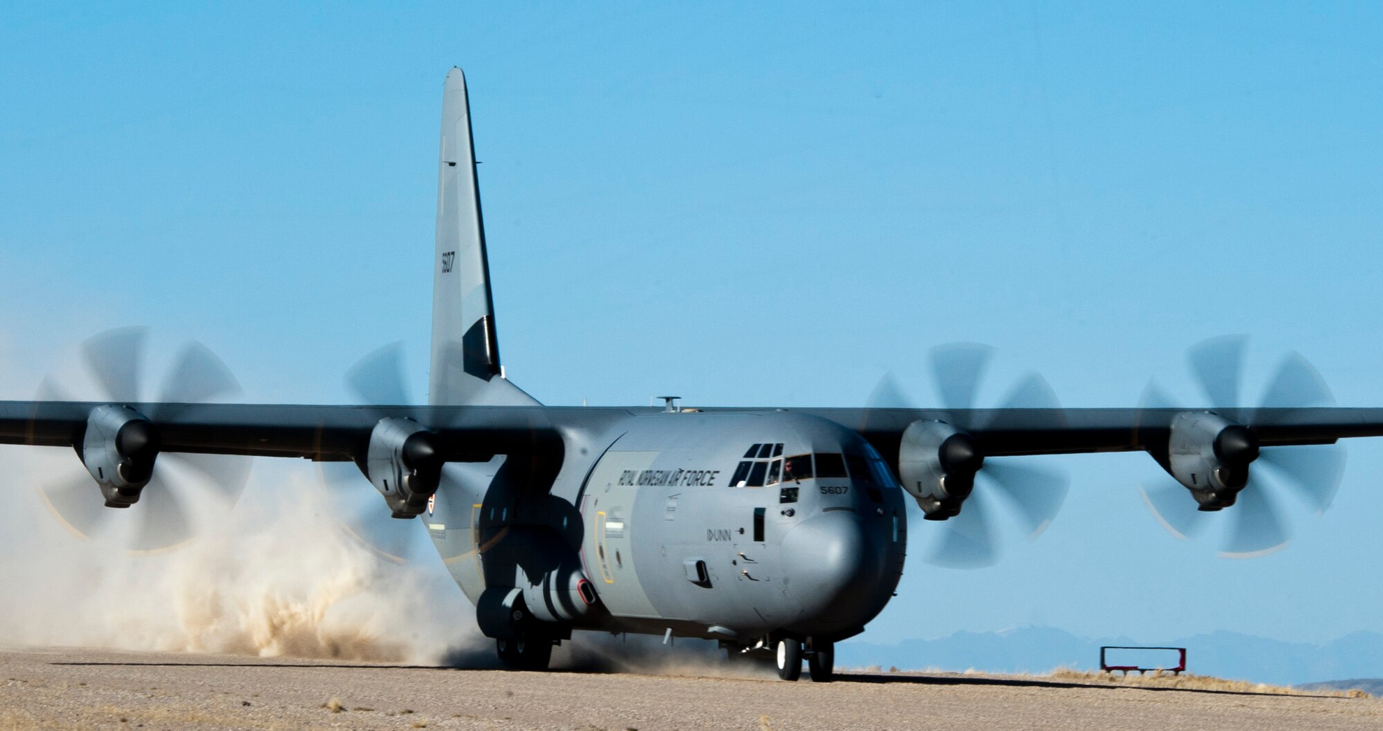 A Royal Norwegian Air Force C-130J Super Hercules takes off after picking up troops during a combat search and rescue training exercise during Red Flag 15-2 on the Nevada Test and Training Range. Red Flag exercises have expanded from air-to-air combat to include all spectrums of warfare including command and control, intelligence, electronic warfare and combat search and rescue. (U.S. Air Force photo by Senior Airman Thomas Spangler)