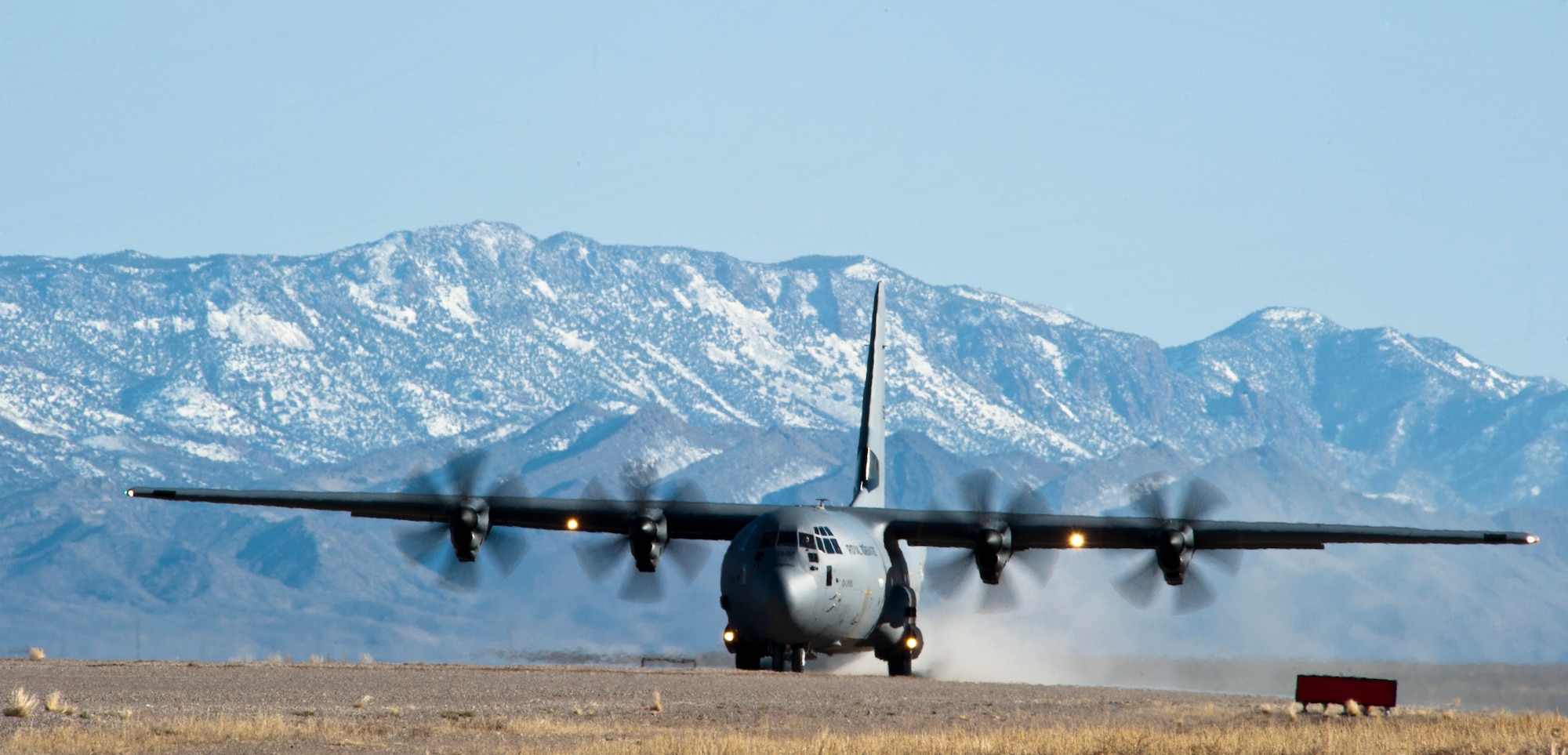 A Royal Norwegian Air Force C-130J Super Hercules lands during a combat search and rescue training exercise during Red Flag 15-2 on the Nevada Test and Training Range, March 6, 2015. By U.S. and allied forces training together in a training environment, they will be more effective in future real-world combat environments. (U.S. Air Force photo by Senior Airman Thomas Spangler)