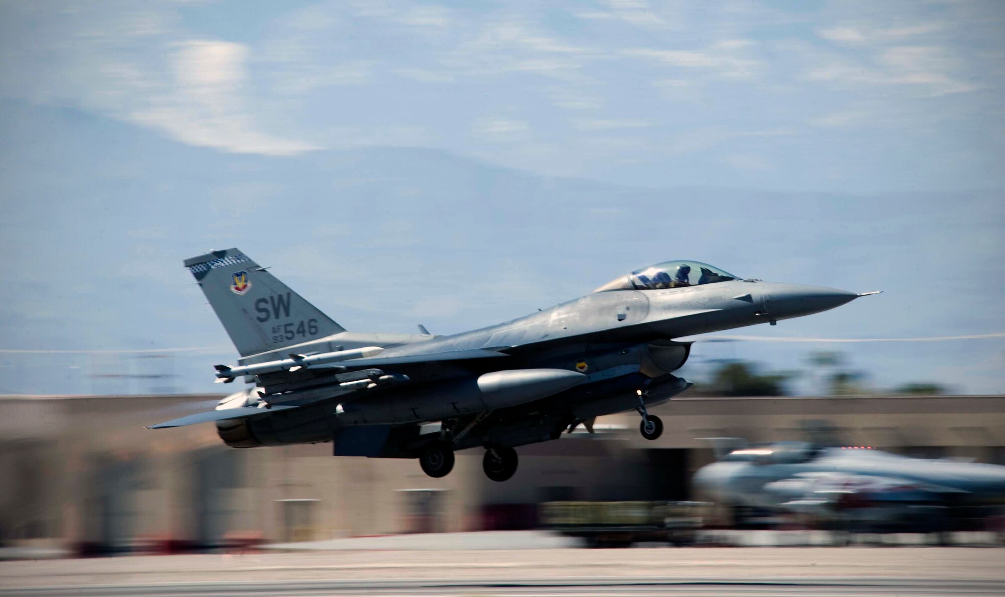 An F-16CJ Fighting Falcon assigned to 55th Fighter Squadron, Shaw Air Force Base, S.C, takes off during Red Flag 15-2 at Nellis AFB, Nev., March 5, 2015. The exercise is one out of a series of advanced training programs administered at Nellis AFB and on the Nevada Test and Training Range by organizations assigned to the U.S. Air Force Warfare Center.(U.S. Air Force photo by Airman 1st Class Rachel Loftis)