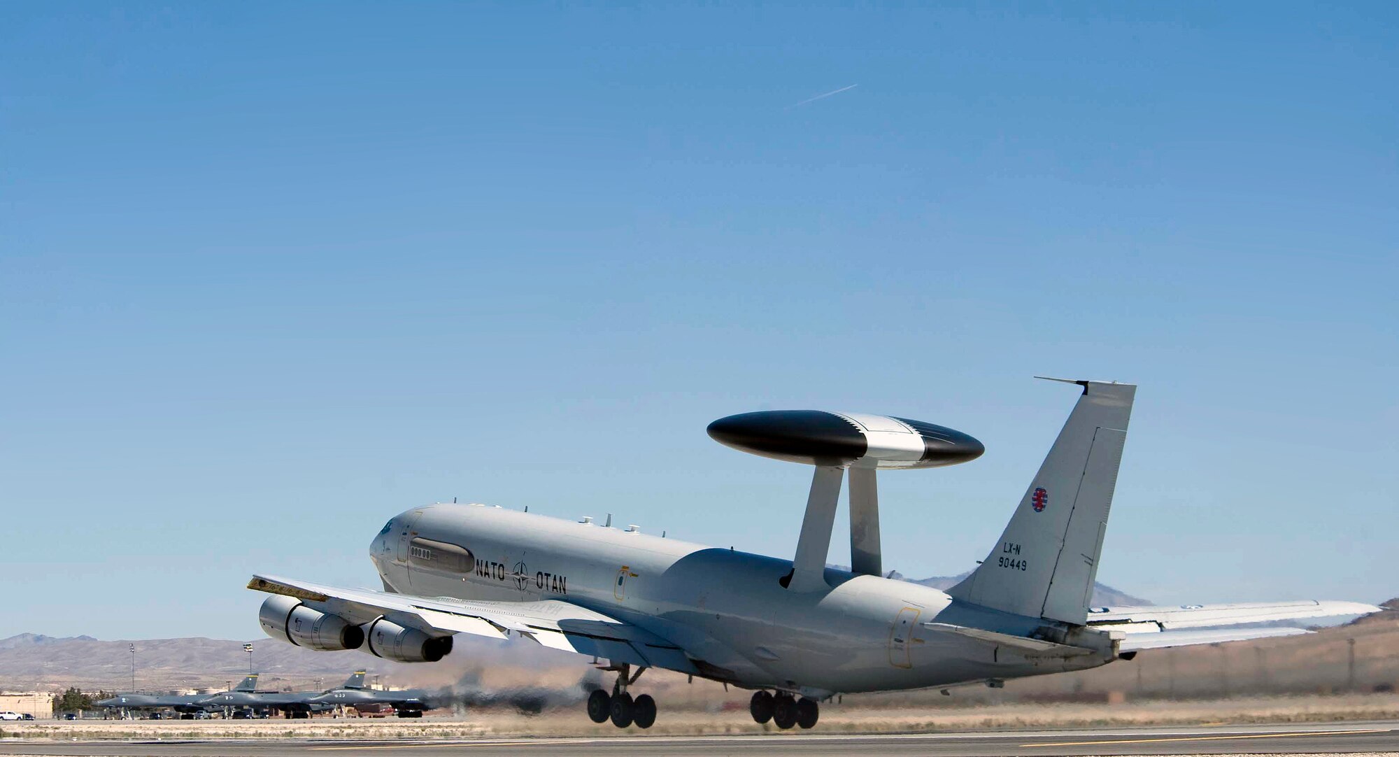 A NATO AWACS from NATO Air Base Geilenkirchen, Germany, takes off into the sky during Red Flag 15-2 from Nellis Air Force Base, Nev., March 5, 2015. Red Flag 15-2 is an exercise providing aircrews and ground crews the opportunity to train and increase combat readiness and effectiveness. (U.S. Air Force photo by Airman 1st Class Rachel Loftis)
