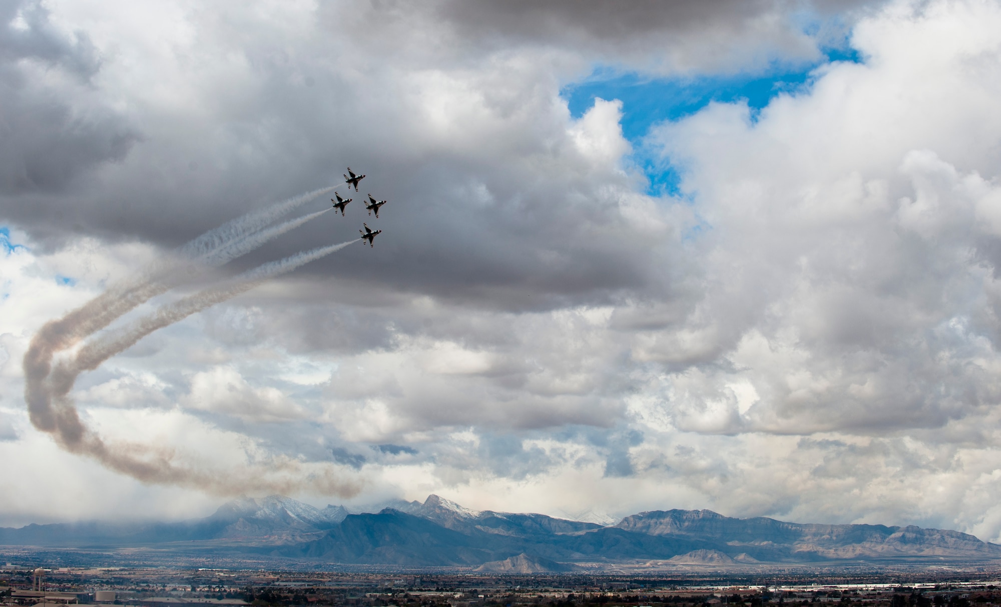 The U.S. Air Force Air Demonstration Team, the Thunderbirds, perform their demonstration in preparation for the commander of Air Combat Command at Nellis Air Force Base, Nev., March 2, 2015. The Thunderbirds have the privilege and responsibility to perform for people all around the world, displaying the pride, precision and professionalism of American Airmen. (U.S. Air Force photo by Senior Airman Thomas Spangler)
