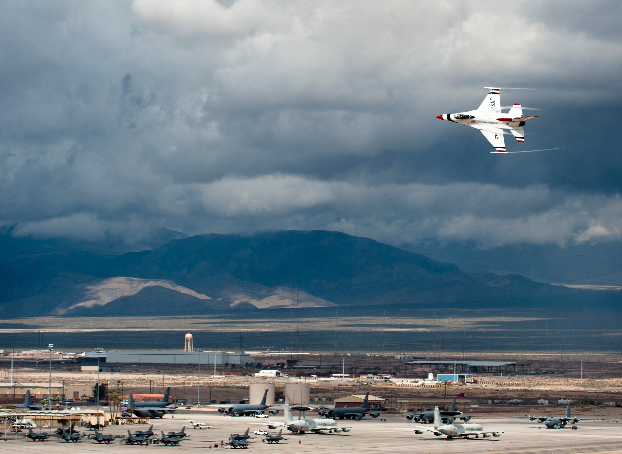 The U.S. Air Force Air Demonstration Team, the Thunderbirds, perform their demonstration in preparation for the commander of Air Combat Command at Nellis Air Force Base, Nev., March 2, 2015. The Thunderbirds Show Line consists of 24 professionals in various aircraft maintenance specialties. They are selected before each demonstration season based on their job proficiency, dedication to duty and overall attitude. (U.S. Air Force photo by Senior Airman Thomas Spangler)