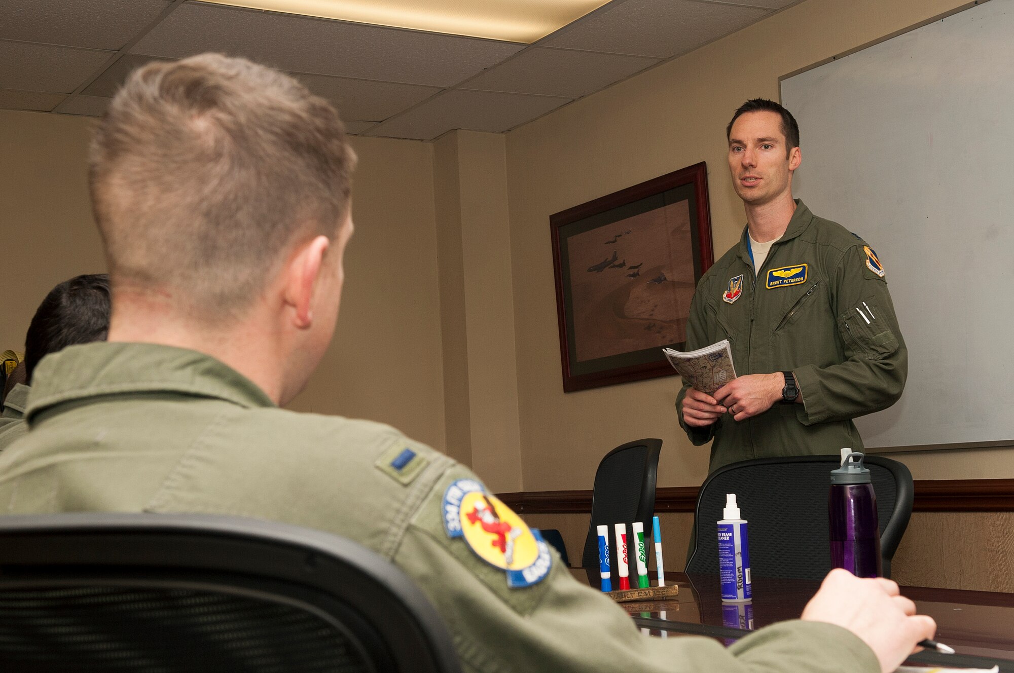 Capt. Brent Peterson, 334th Fighter Squadron instructor pilot, debriefs students after a training flight, Dec. 10, 2014, at Seymour Johnson Air Force Base, North Carolina. Instructors come in from one of six operational squadrons located  at Mountain Home AFB, Idaho, Royal Air Force Lakenheath, England, or Seymour Johnson’s own 335th “Chiefs” and 336th “Rockets” FSs. (U.S. Air Force photo/Airman Shawna L. Keyes)   