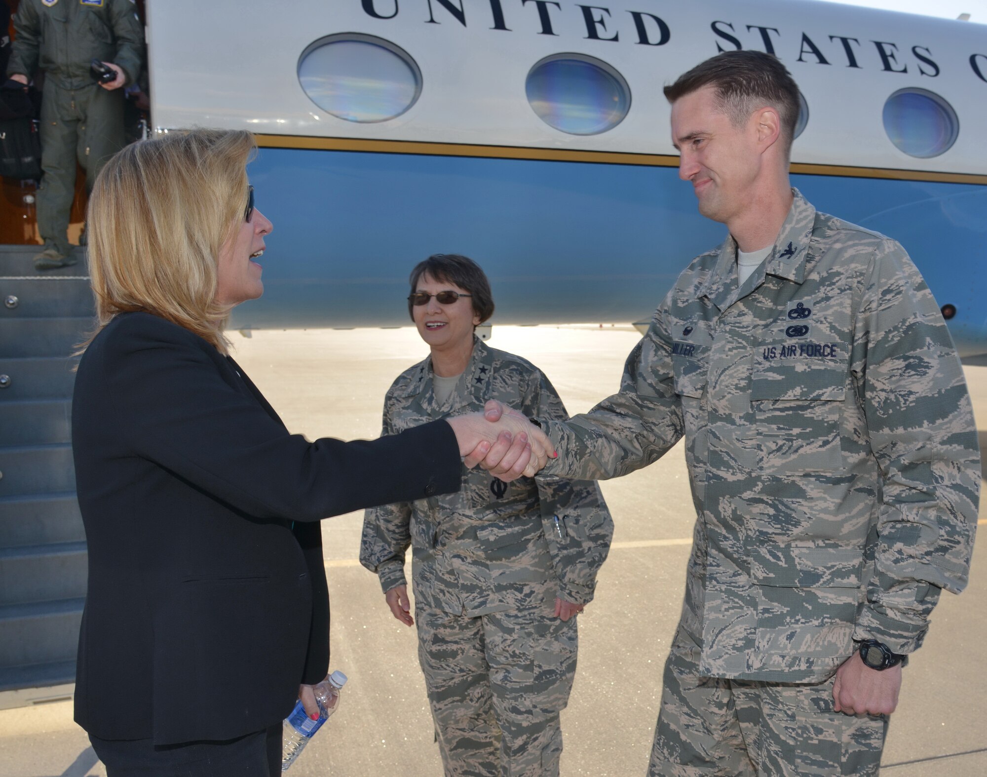 Secretary of the Air Force Deborah Lee James is greeted by Col. Tom Miller, 377th Air Base Wing commander, and Maj. Gen. Sandra Finan, Air Force Nuclear Weapons Center commander, upon her arrival to Kirtland Air Force Base March 9. James is at the installation to visit Airmen and prominent units, such as the AFNWC, the Kirtland Underground Munitions and Maintenance Storage Complex, the Air Force Inspection Agency and the Air Force Operational Test and Evaluation Center. (Photo by Ken Moore)