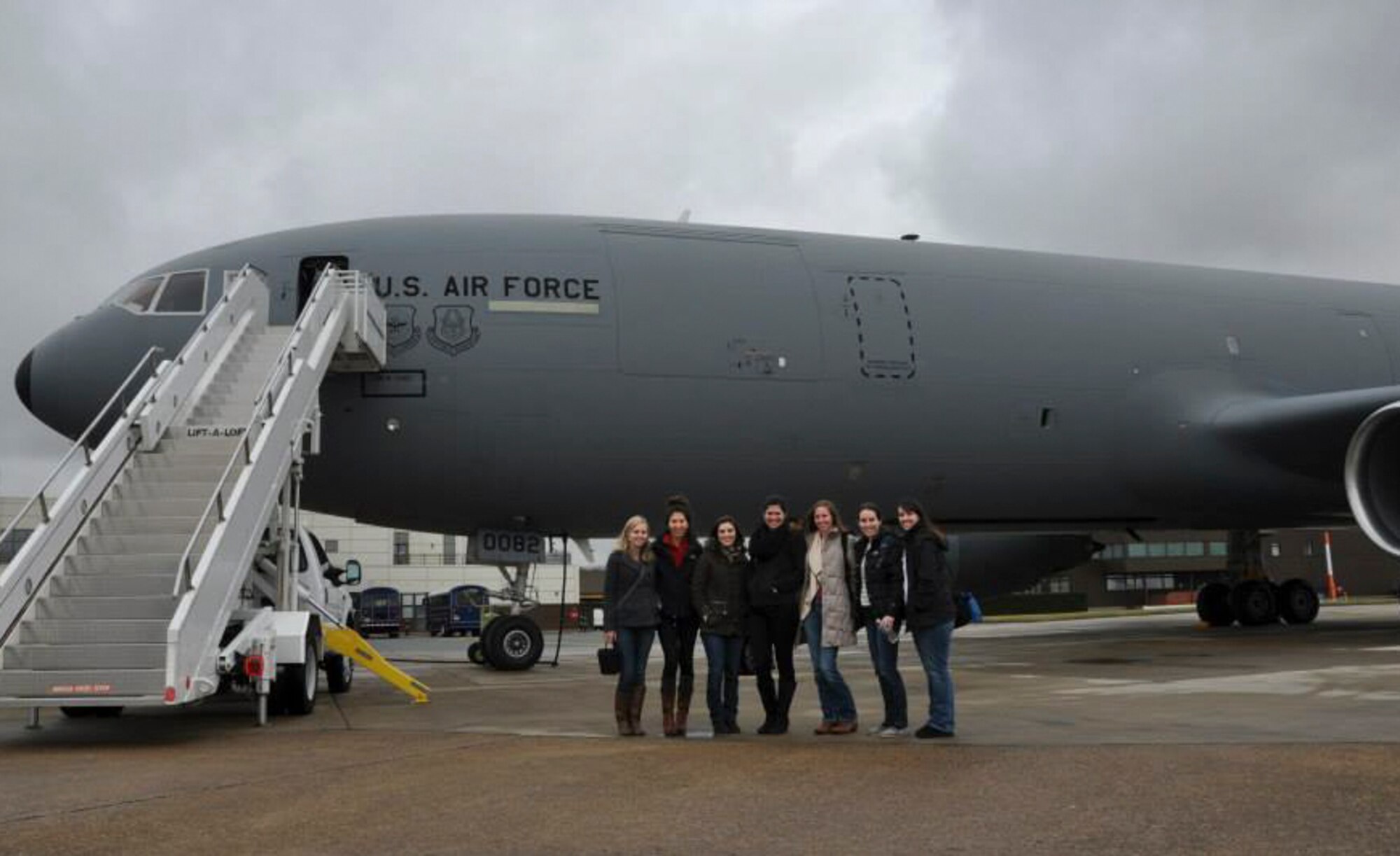 Spouses from the 48th Fighter Wing pose in front of a KC-10 Extender after participating in an aerial refueling mission over the North Sea Feb. 20, 2015. This flight gave spouses an opportunity to witness a mission firsthand and a better understanding of the jobs their loved ones perform on a regular basis. (U.S. Air Force photo/Tech. Sgt. Jonathan E. White/Released)