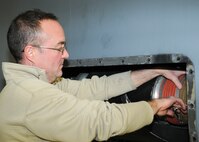 Master Sgt. Jim Buist, noncommissioned officer in charge of electrical and environmental systems with the 910th Aircraft Maintenance Squadron here, reassembles an air conditioning duct on a C-130H Hercules aircraft, March 7, 2015. Buist replaced the duct after an inspection revealed a crack in a holding bracket. (U.S. Air Force Photo/Tech. Sgt. Rick Lisum)