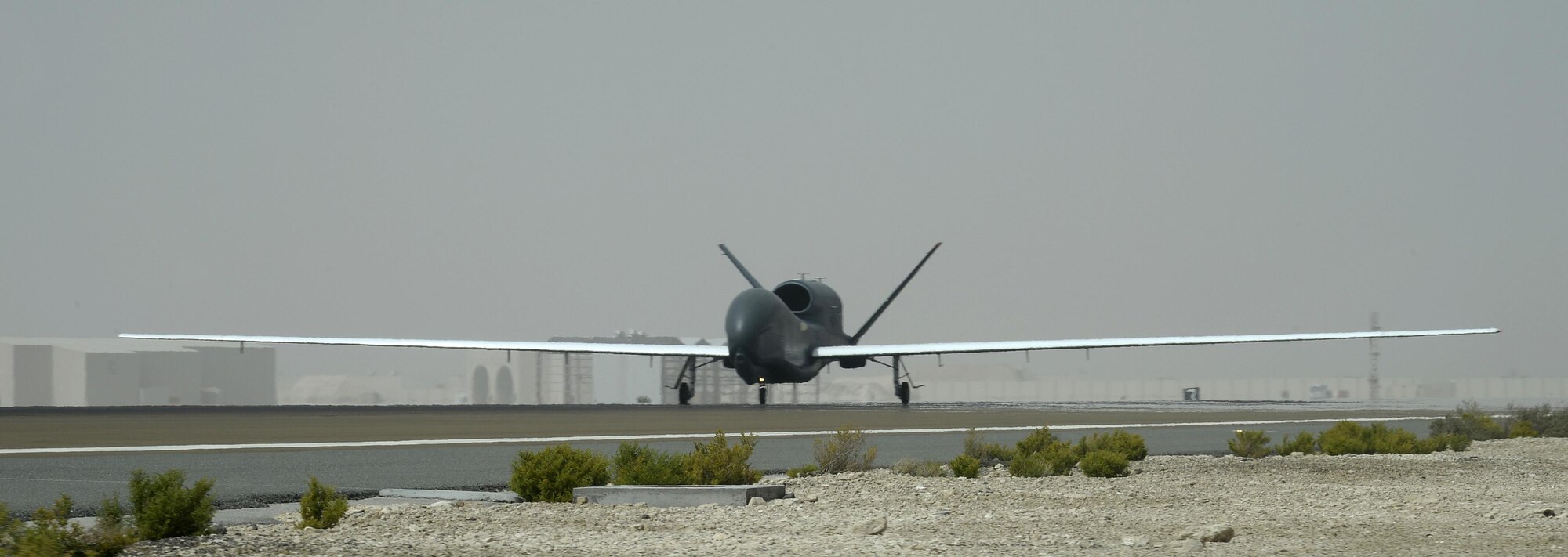 RQ-4 Global Hawk aircraft 2019 lands at an undisclosed location in Southwest Asia Mar. 8, 2015. A2019 flew a 30.5 hour mission in support of Operation Inherent Resolve, surpassing the 10,000 flying hour milestone. A2019 also holds the record for the longest block 20 flight, which lasted 31.5 hours. (U.S. Air Force photo/Tech. Sgt. Marie Brown) 