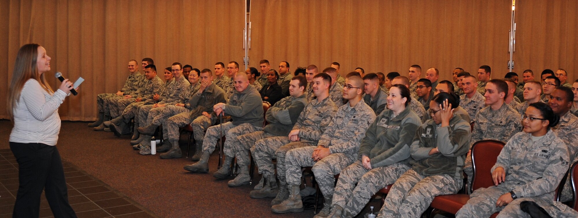 Harmony Miscisin, Sexual Assault Prevention and Response intern, speaks to the 2nd Logistics Readiness Squadron at the new Sexual Assault Theater Group's production at Barksdale Air Force Base, La., March 5, 2015. According to a national study by the Department of Justice every 108 seconds a rape or sexual assault is committed. The scenes SATG acts out are more real to Airmen than information at a briefings, it also allows the characters to promote discussions from Airmen. (U.S. Air Force photo/Staff Sgt. Jason McCasland)

