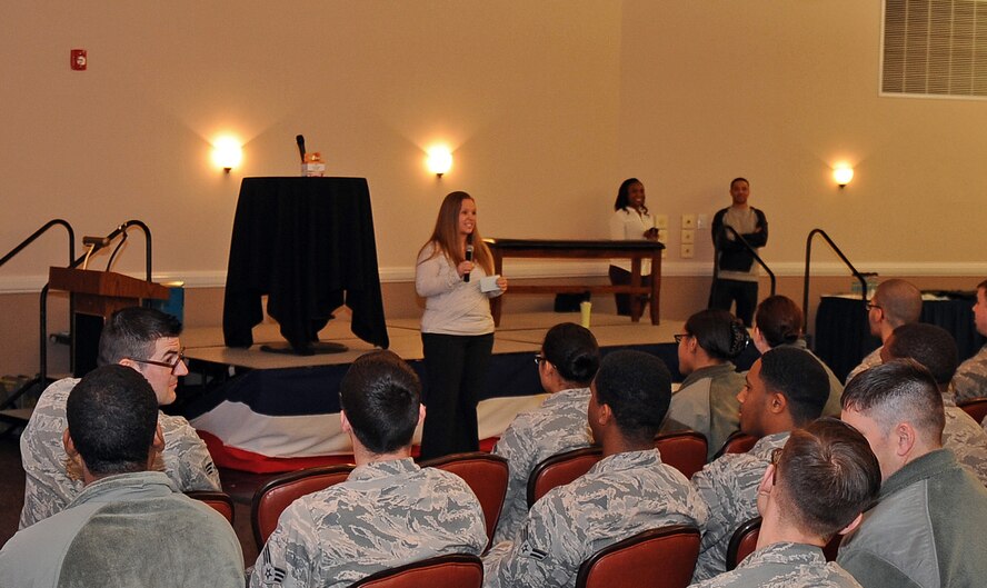 Harmony Miscisin, Sexual Assault Prevention and Response intern, speaks to the 2nd Logistics Readiness Squadron at the new Sexual Assault Theater Group's production at Barksdale Air Force Base, La., March 5, 2015. According to a national study by the Department of Justice, every 108 seconds a rape or sexual assault is committed. The scenes SATG acts out are more realistic to Airmen than information at a briefing, it also allows the characters to promote discussions among Airmen. (U.S. Air Force photo/Staff Sgt. Jason McCasland)
