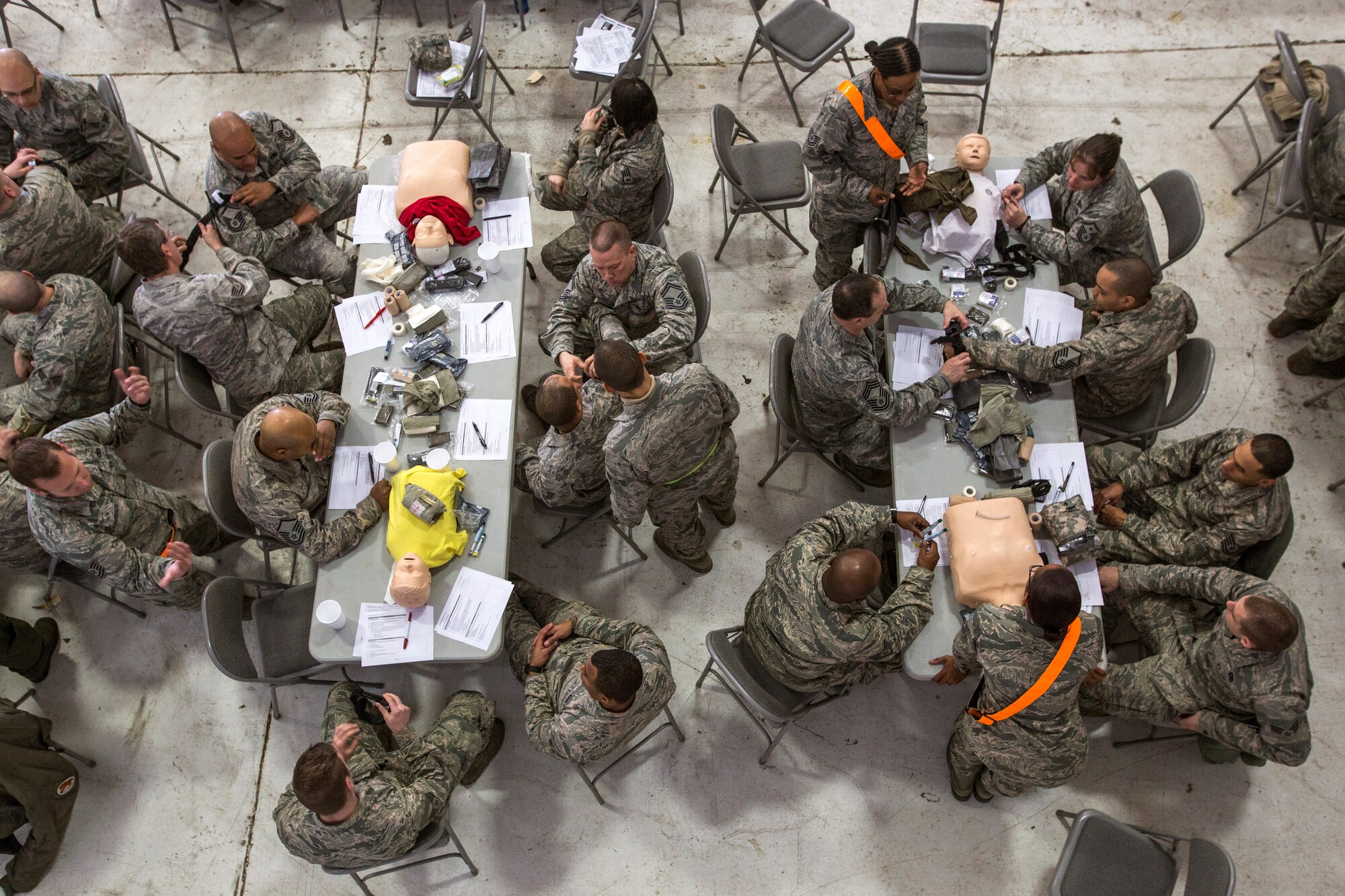 Airmen from the 108th Wing, New Jersey Air National Guard, practice self-aid buddy care skills during the Wing’s Expeditionary Skills Rodeo at Joint Base McGuire-Dix-Lakehurst, N.J., March 6, 2015. In addition, they trained on their ability to survive and operate in a chemical, biological, radiological and nuclear environment. These skills make up the foundation necessary for all Airmen to function effectively in hostile environments. (U.S. Air National Guard photo by Master Sgt. Mark C. Olsen/Released)