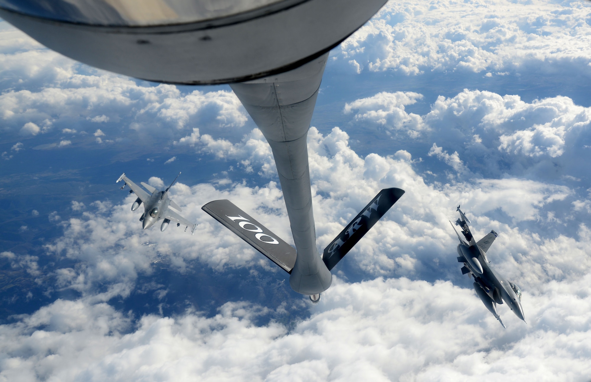 F-16 Fighting Falcons from the 31st Fighter Wing, Aviano Air Base, Italy, execute formation maneuvers after refueling from a KC-135 Stratotanker from the 100th Air Refueling Wing, RAF Mildenhall, England, March 4, 2015, during Exercise Iron Hand over southern France. Through forward presence and ready forces, U.S. Air Forces in Europe – Air Forces Africa executes missions in support of regional and global operations to provide global vigilance, global reach and global power for national objectives across an area spanning 104 countries. (U.S. Air Force photo by Senior Airman Kate Maurer/Released)