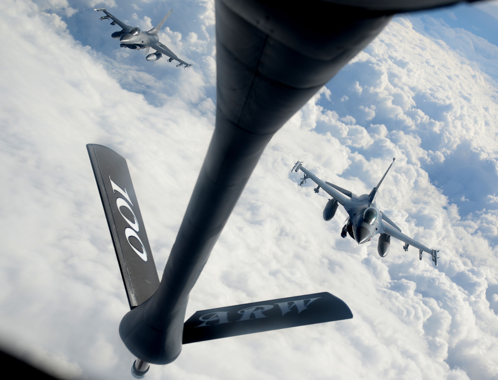 F-16 Fighting Falcons from the 31st Fighter Wing, Aviano Air Base, Italy, fly in formation after refueling from a KC-135 Stratotanker from the 100th Air Refueling Wing, RAF Mildenhall, England, March 4, 2015, during Exercise Iron Hand over southern France. U.S. Air Forces in Europe – Air Forces Africa forward-based, ready forces and partnerships allow its wings to provide timely, decisive airpower to meet emerging challenges and execute missions across Europe and Africa. (U.S. Air Force photo by Senior Airman Kate Maurer/Released)