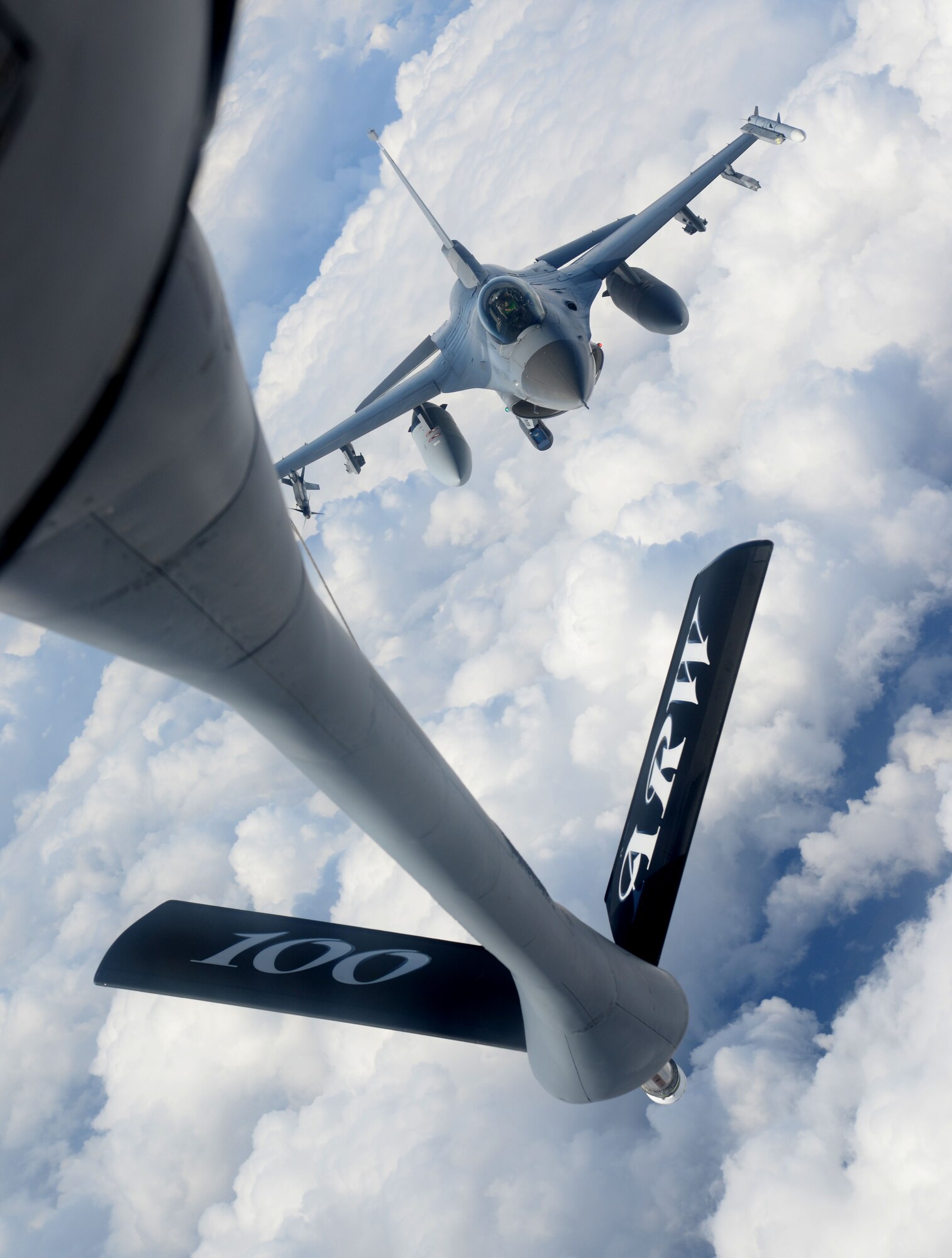 An F-16 Fighting Falcon from the 31st Fighter Wing, Aviano Air Base, Italy, approaches for air refueling from a KC-135 Stratotanker from the 100th Air Refueling Wing, RAF Mildenhall, England, March 4, 2015, during Exercise Iron Hand over southern France. The aircraft were participating in a combined training event designed to enhance interoperability between the two wings and refine techniques and procedures. This type of planned, routine training allows for a key opportunity for U.S. Air Forces in Europe – Air Forces Africa wings to work with each other to ensure they are ready to conduct real-world missions effectively and efficiently when called upon. (U.S. Air Force photo by Senior Airman Kate Maurer/Released)