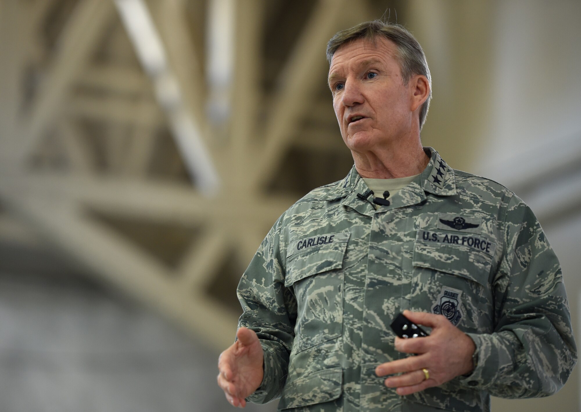 U.S. Air Force Gen. Hawk Carlisle, commander of Air Combat Command, briefs Airmen of the 432nd Wing/432nd Air Expeditionary Wing during an all-call as part of his visit March 4, 2015, to Creech Air Force Base, Nevada. During the all-call, Carlisle outlined ACC priorities, expectations of today’s Airmen, as well as sexual assault and suicide prevention. (U.S. Air Force photo by Tech. Sgt. Nadine Barclay/Released)
