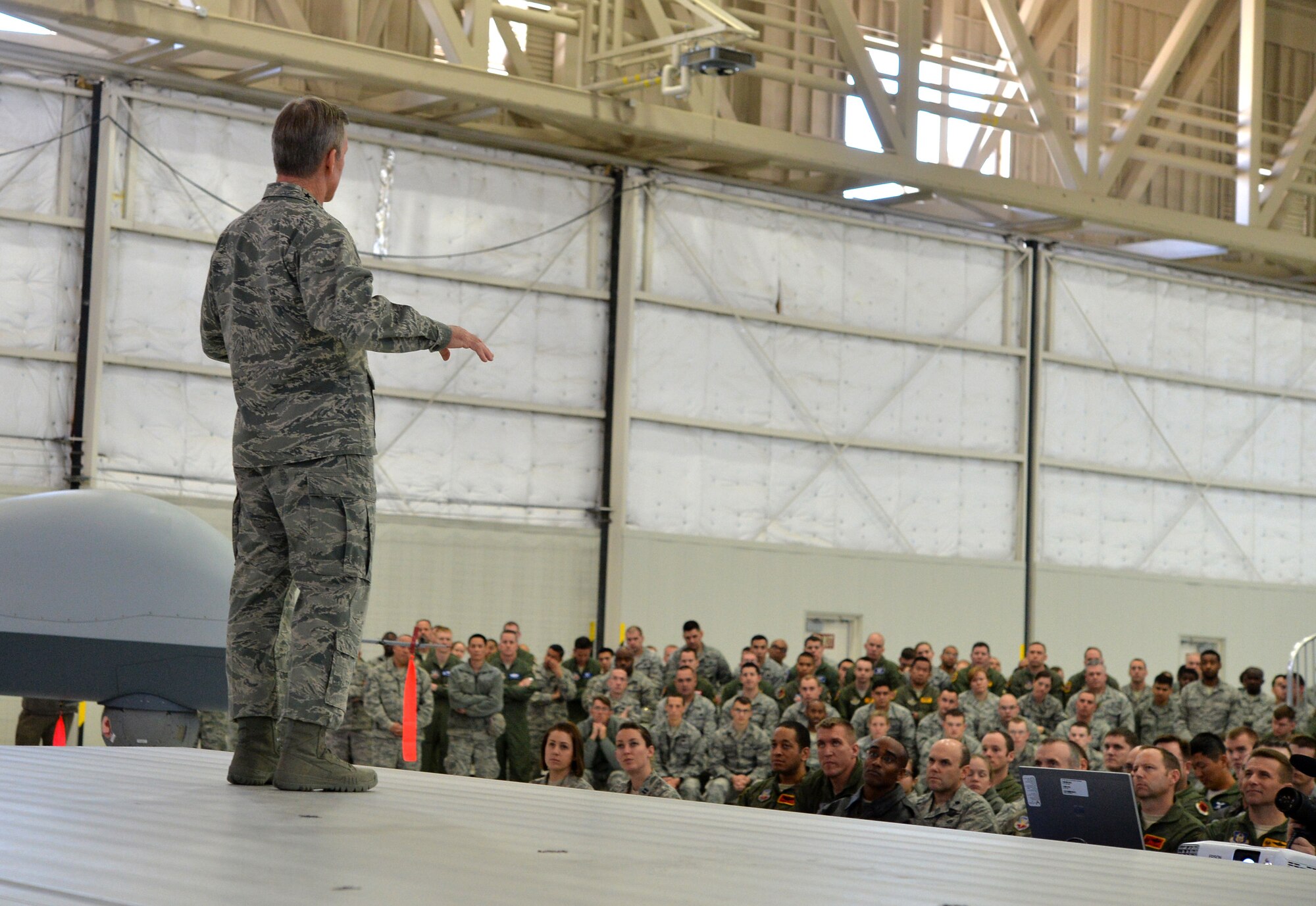 U.S. Air Force Gen. Hawk Carlisle, commander Air Combat Command, briefs Airmen during an all-call as part of his visit March 4, 2015, to Creech Air Force Base, Nevada. During the all-call, Carlisle outlined ACC priorities, what he expects of Airmen, as well as sexual assault and suicide prevention. (U.S. Air Force photo by Senior Airman Adarius Petty/Released)