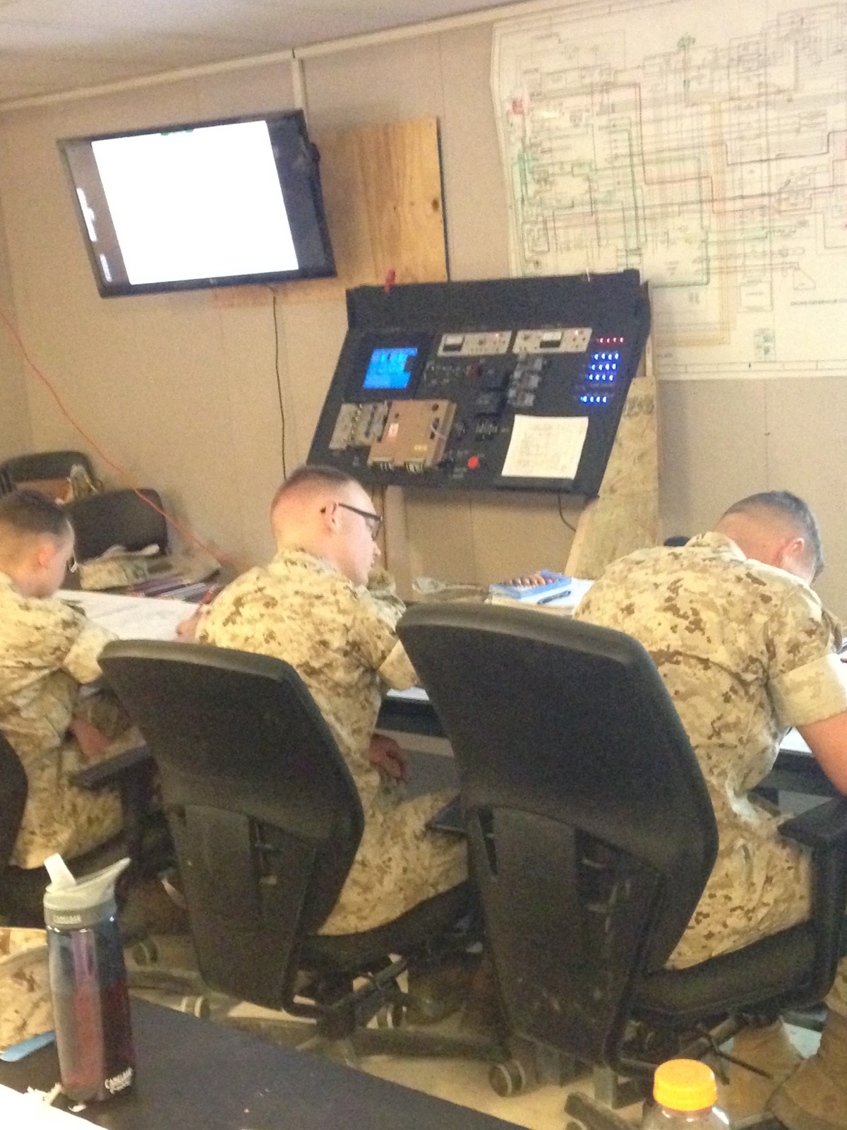Marines working on schematics.