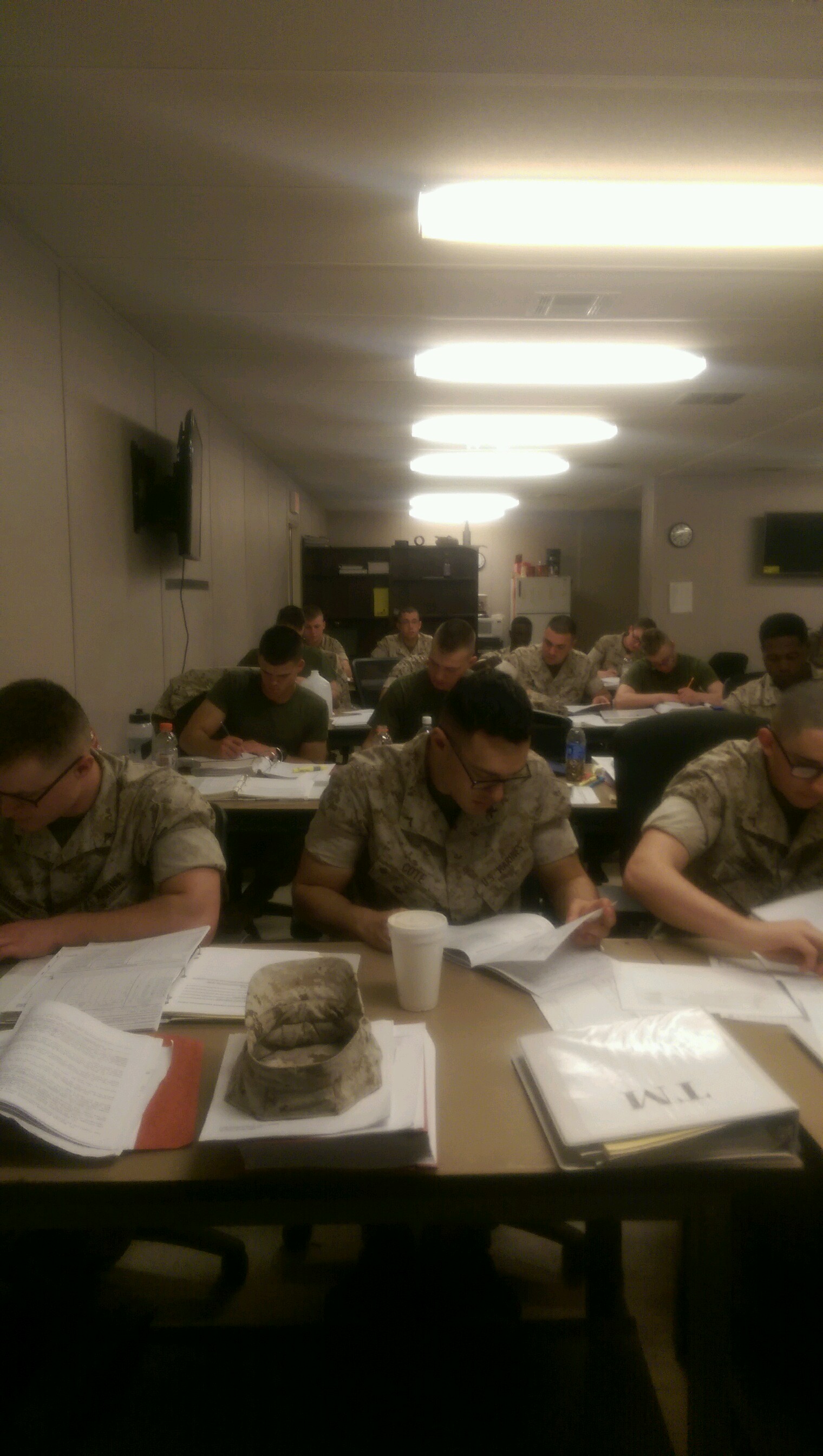 Marines work on technical manuals.