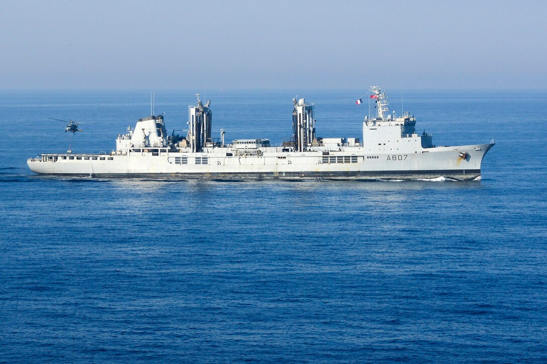 The French Navy's replenishment oiler Meuse transits in the U.S. 5th Fleet area of operations during a vertical replenishment with the aircraft carrier USS Carl Vinson, March 2, 2015.
