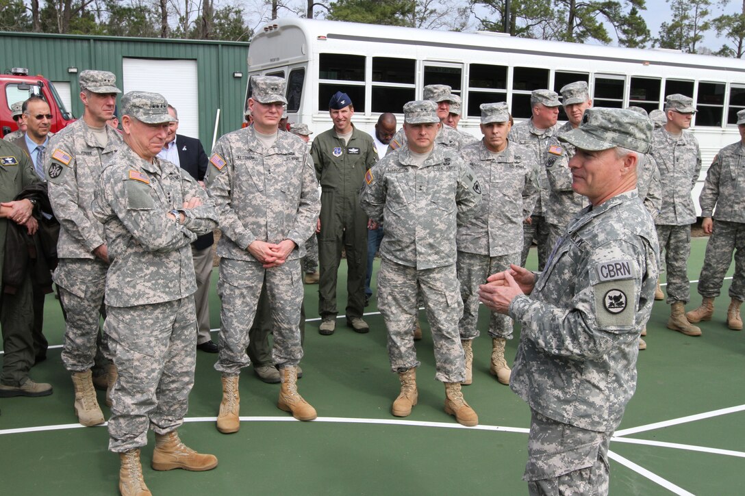 Army Lt. Col. Stephen Messer, assigned to U.S. Northern Command, welcomes Army Gen. Frank J. Grass, chief of the National Guard Bureau; Maj. Gen. Robert E. Livingston Jr., adjutant general of South Carolina; and other dignitaries to Choppee Regional Resource Center in Georgetown, S.C., one of the training locations for exercise Vigilant Guard 2015, March 9, 2015.