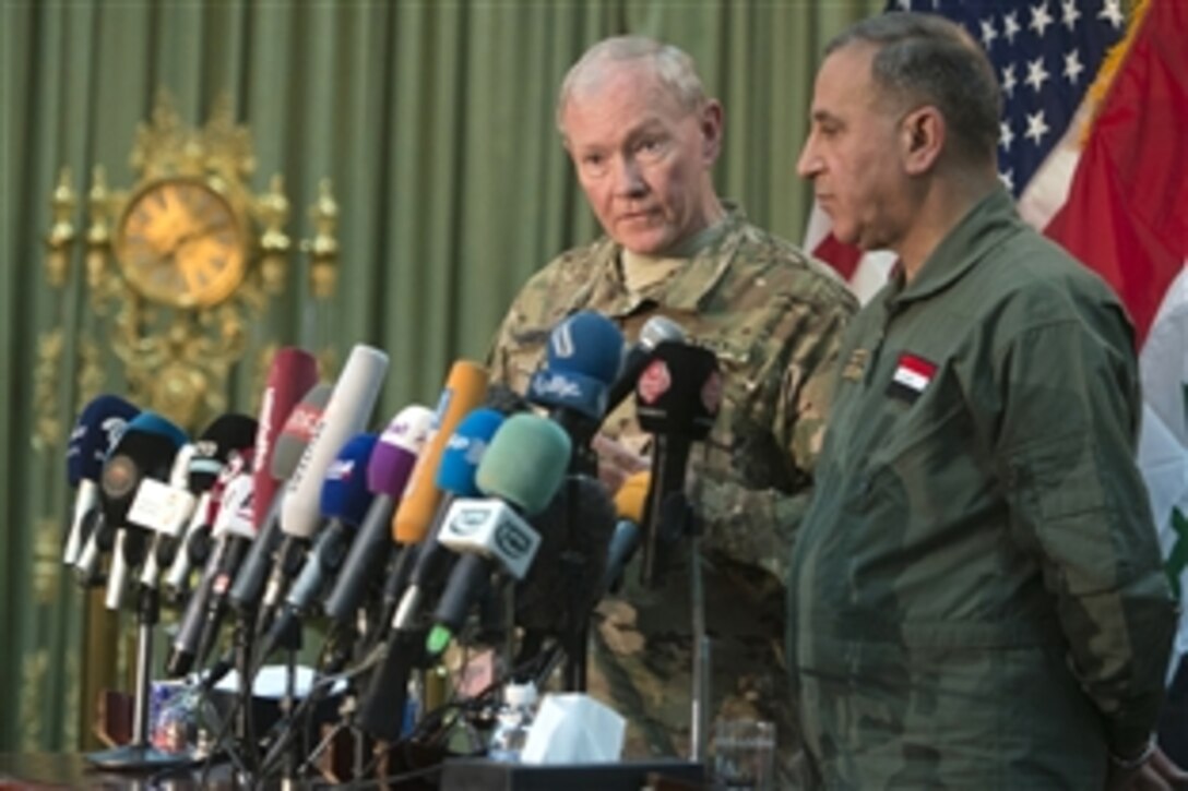 Iraqi Defense Minister Khaled al-Obeidi and U.S. Army Gen. Martin E. Dempsey, chairman of the Joint Chiefs of Staff, conduct a press conference in Baghdad, March 9, 2015. 