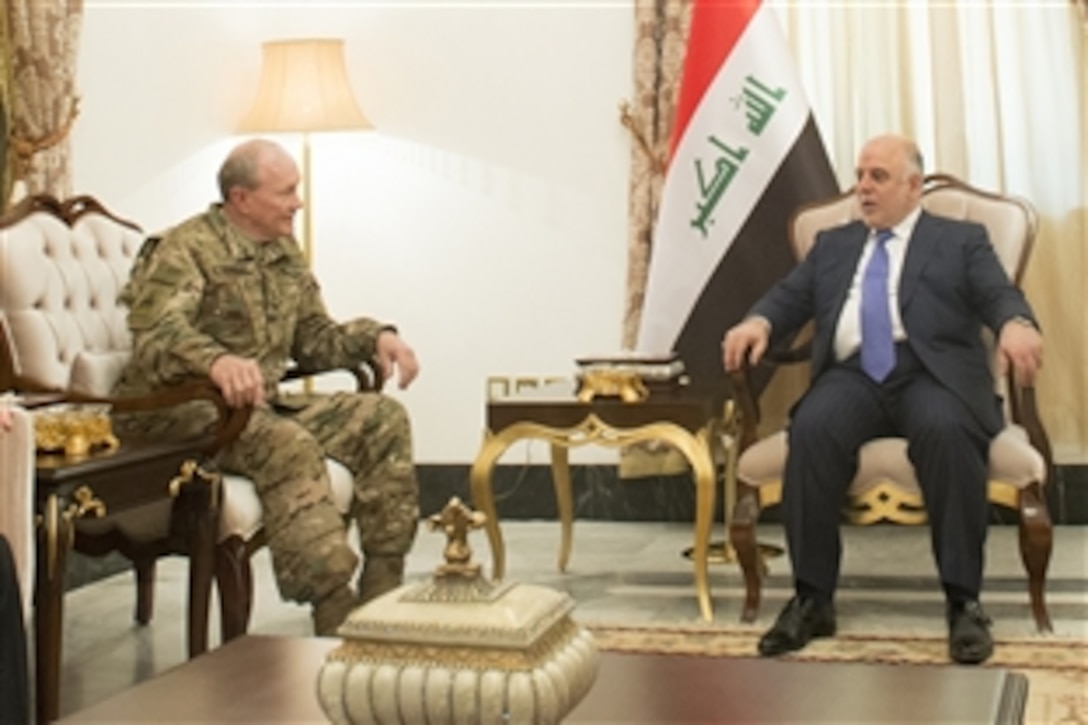 Iraqi Prime Minister Haider al-Abadi, right, and U.S. Army Gen. Martin E. Dempsey, chairman of the Joint Chiefs of Staff, meet in Baghdad, March 9, 2015. 
