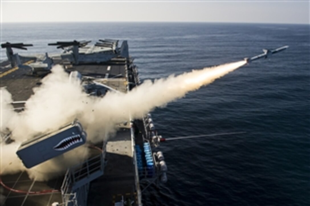 A RIM-7 NATO Sea Sparrow Missile is fired from the forward launcher aboard the amphibious assault ship USS Essex during a live-fire exercise in the Pacific Ocean, March 9, 2015. 
