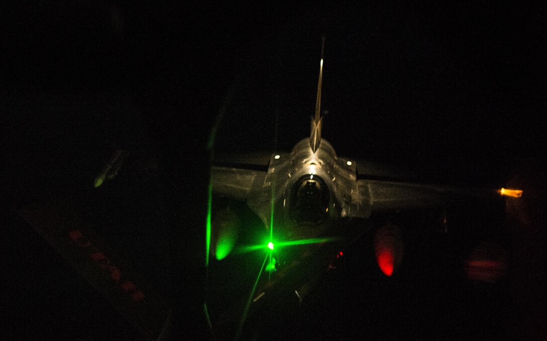 A Royal Netherlands Air Force F-16 Fighting Falcon receives fuel from a U.S. Air Force KC-135 Stratotanker assigned to the 340th Expeditionary Air Refueling Squadron, Mar 10, 2015, over Iraq. The F-16 will strike Da'esh targets in support Operation Inherent Resolve.(U.S. Air Force Photo/ Staff Sgt. Perry Aston)