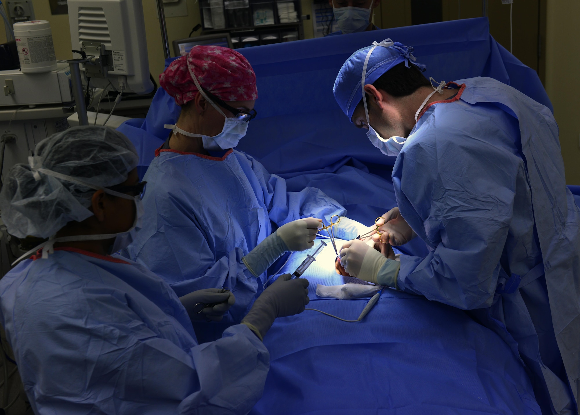 A 31st Surgical Operations Squadron surgical team performs minor surgery on a patient March 4, 2015, at Aviano Air base, Italy. The 31st SGOS offers surgical specialty care in support of the primary care mission to ensure a deployable fighting force. (U.S. Air Force photo/Airman 1st Class Ryan Conroy)