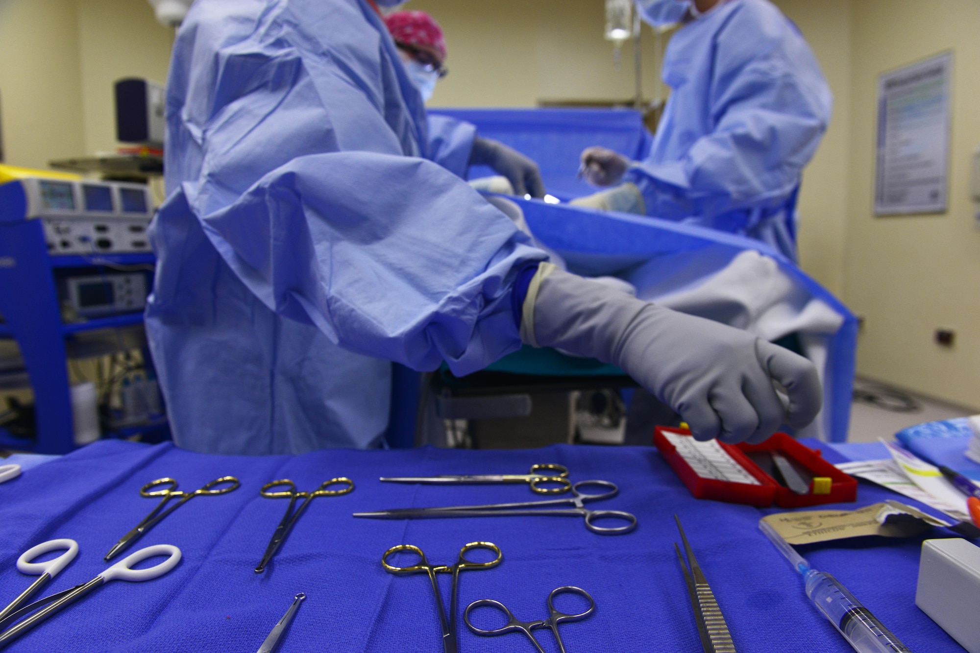 Senior Airman Sylvia Coon reaches for a syringe during a surgery March 4, 2015, at Aviano Air Base, Italy. The 31st Surgical Operations Squadron offers surgical specialty care in support of the primary care mission to ensure a deployable fighting force. Coon is a 31st Surgical Operations Squadron surgery technician. (U.S. Air Force photo/Airman 1st Class Ryan Conroy)