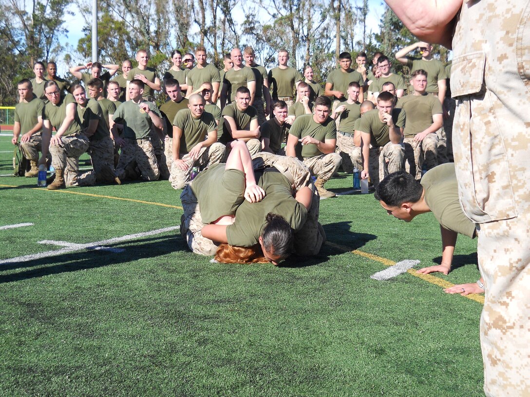On January 12, 2015 the Marines of Marine Corps Detachment, Presidio of
Monterey conducted a fast-paced 2.2-mile ruck run with 35-lb packs.
Pictured is one of the ground-fighting bouts from the MCMAP session at the
halfway point of the run.
