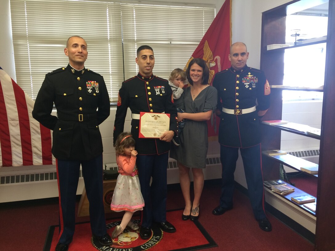 The Commanding Officer and Senior Enlisted Advisor of Marine Corps Detachment, Presidio of Monterey present a Navy and Marine Corps Achievement Medal to a distinguished student Sergeant in the attendance of his family.  Concurrent with his graduation, he was recognized for his leadership, dedication, and academic achievement while serving as both a student and a Platoon Sergeant.