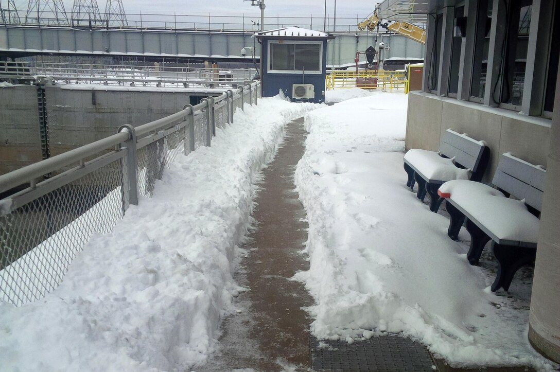 Pathways were made at Kentucky Lock in Grand Rivers, Ky., for personnel to keep navigation open at the lock on the Tennessee River.  Lock Mechanic Bill Peek is credited with making it to the project and working to clear the snow March 5, 2015. The lock is maintained and operated by the U.S. Army Corps of Engineers Nashville District.