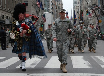 Maj. Sean Flynn, commander of the 1st Battalion 69th Infantry, and piper Joe Brady lead the officers and men of the New York Army National Guard's 1st Battalion 69th Infantry up 5th Avenue at the start of New York City's St. Patrick's Day Parade on March 17, 2014. The 69th Infantry has led the annual St. Patrick's Day parade every year since 1851. 